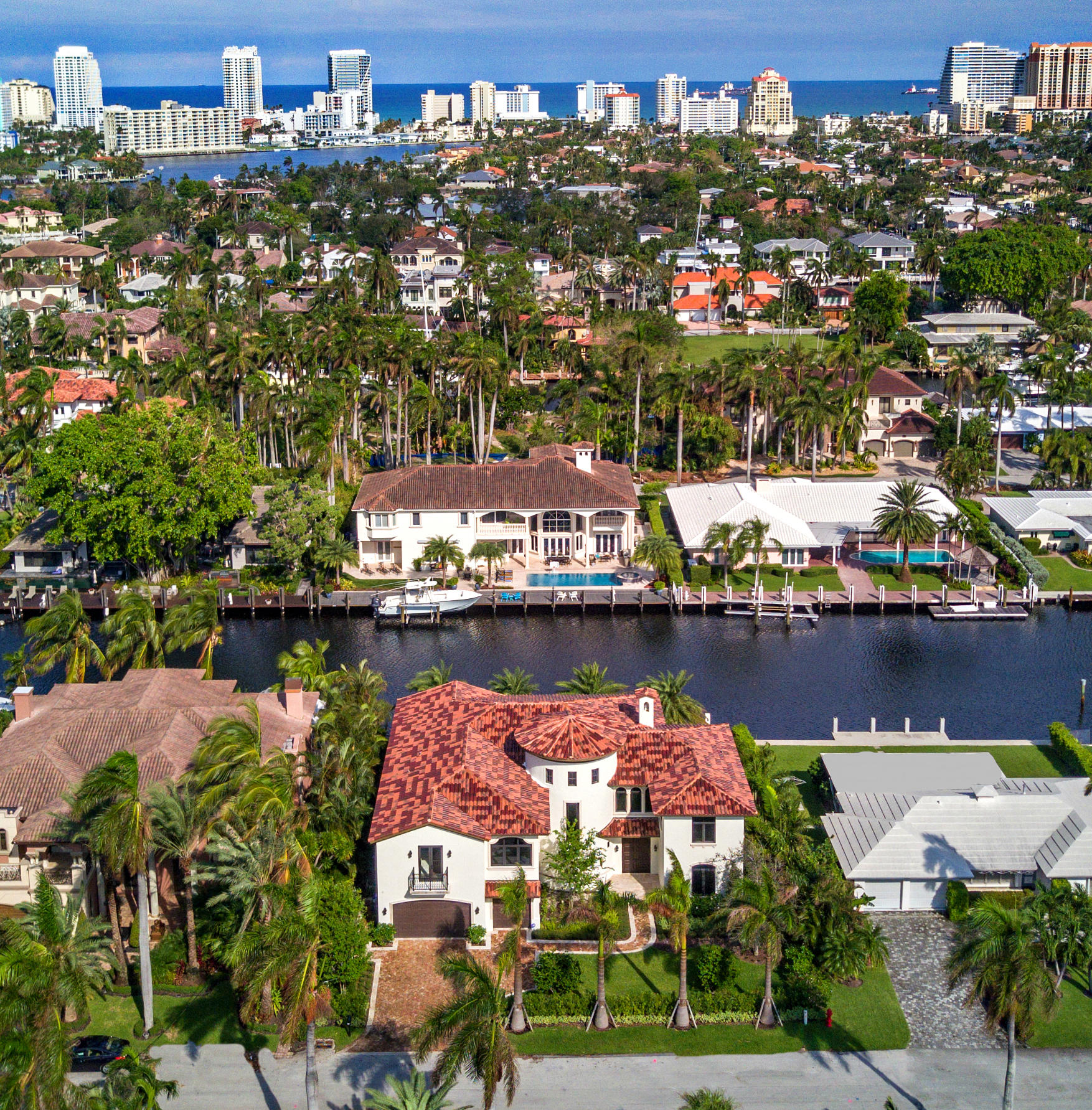 Make a statement with this new, 6 bedroom, 5.5 bath, WOW home in one of Fort Lauderdale’s most prestigious waterfront neighborhoods of Nurmi Isles. Overlooking a heated saltwater pool with outdoor shower and new 85’ concrete dock/seawall along the Venetian inspired 120’ wide deepwater canal on 95 feet of waterfront, witnessed both day and night from every major room. Even the spacious downstairs office fronts the water. A contemporary, well appointed gourmet kitchen featuring Thermadore appliances is open to the family room affording the chef views as well. Guests in the dining room and living area both can enjoy the visual warmth of the gas fireplace while sipping champagne during holidays. Take the impressive stairway or the elevator to the second floor and the master suite which opens to a 450+ square foot covered terrace. An 'every woman's dream' closet as well as a his and hers luxurious bath complete this sensational suite. Custom Italian marble throughout, including the upstairs and downstairs laundry rooms. Pre-wired for exterior security cameras. Walk-able to restaurants and shops on Las Olas, a bike ride to the beach or downtown and minutes to ocean access via Port Everglades by boat.