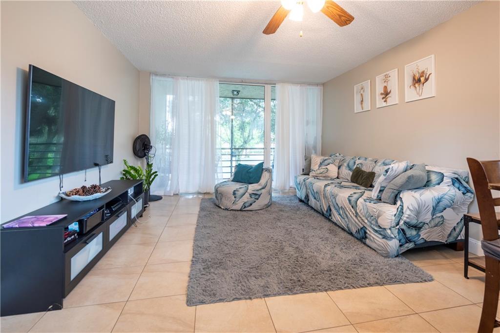 Remodeled 2BR/2BA larger corner unit with large screened in patio & golf course view. In the heart of Davie with easy access to major roads, shopping, & recreation. “A” rated schools! Split, double master BR/BA with lots of closet space. Ceiling fans in every room. Tile floors throughout, freshly painted, newer stainless steel appliances, newer hot water heater, newer electrical box, GFI’s, and all impact windows and doors. Ample parking with assigned parking space. Pet friendly community with pool. Residents enjoy Pine Island Ridge Golf & Country Club: Community Pool, Activity Room, Sauna, Billiards, Shuffleboard, Tennis, Par 66 Golf Course, Fitness Center, BBQ/Picnic Area, Entertainment/Shows, Lakeview Restaurant & more! Subject to current lease (expires 6/23), no rental restrictions.