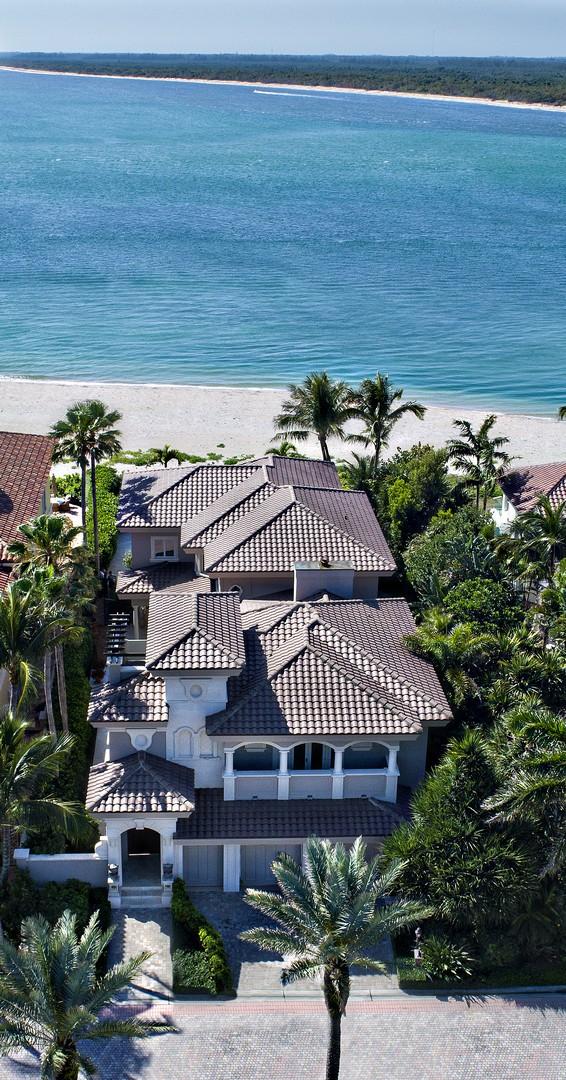 ''Villa Del Mar'' is an EXQUISITE two story OCEANFRONT ESTATE with endless turquoise views.  Views to the south of the home, (which are considered to be one of the BEST views South Florida has to offer) are surrounded by private white sandy beaches which creates ULTIMATE island living!  A brand new top of the line kitchen,  featuring a La Cornue Chateau range, oven and hood;  The addition of the 750 bottle  ''temperature controlled'' wine/safe room are only some of the updates made in 2015.  This seaside retreat also features 5 en-suite bedrooms, 8 full baths, an office and a 2.5 car air conditioned garage. A MUST TO SEE!