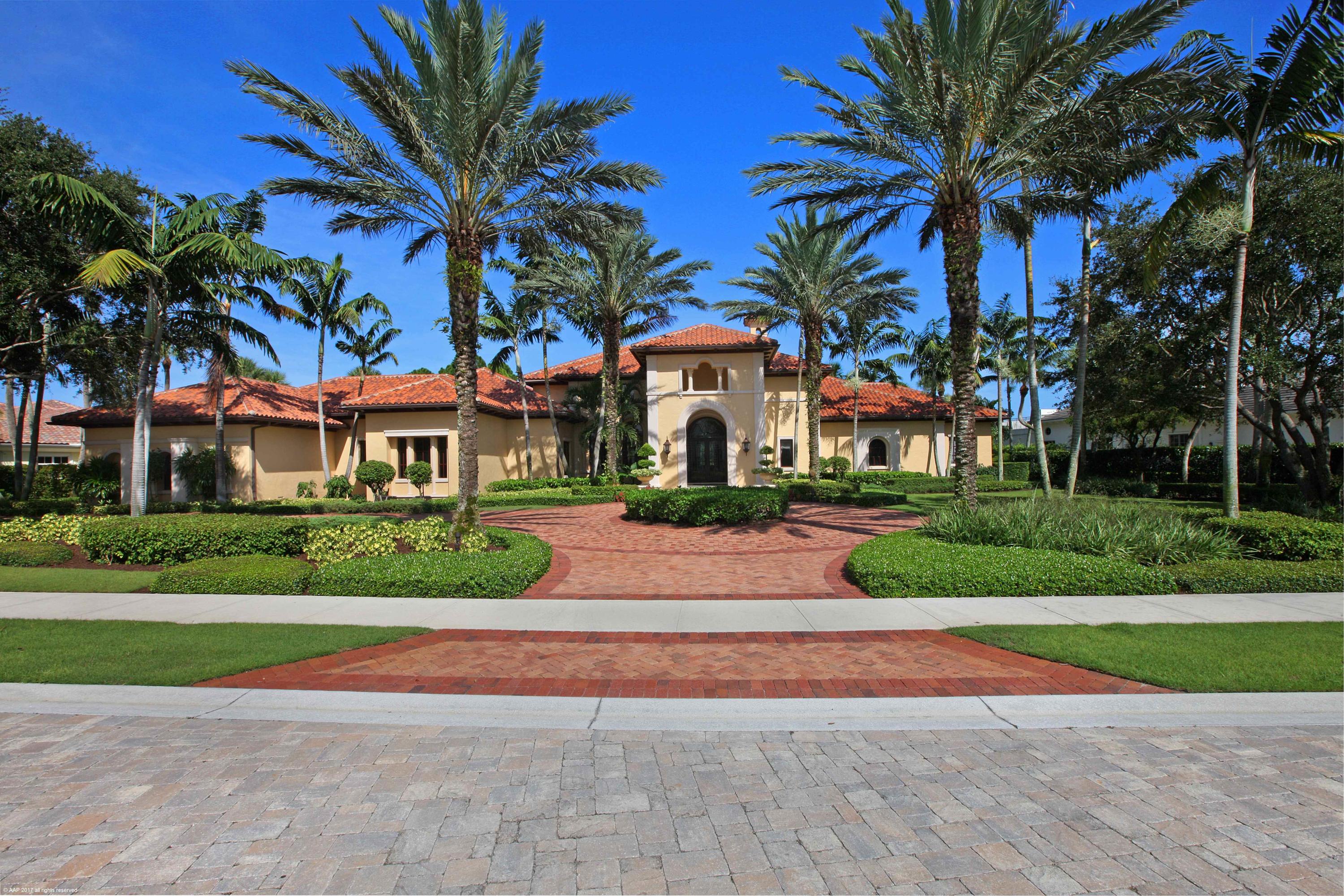 Beautifully appointed former builder model with stunning golf course view.  This home boasts volume ceilings, crown molding throughout, marble floors, his and her master baths, handsome library, theater room and club room, this home has it all!  The expansive lanai and custom heated pool and spa are perfect for entertaining, complete with built in summer kitchen and bbq.