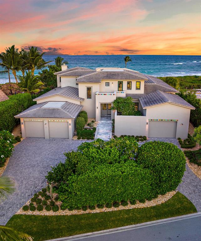 Situated on one of the premier oceanfront lots of Jupiter Inlet Colony, this spectacular home features over 100' of prime Jupiter Island beachfront. The high elevation with lush emerald green landscaping offers unobstructed panoramic views of the turquoise Atlantic Ocean. Built of the highest quality, this spacious contemporary residence boasts 5 beds, 5.5 baths with ample closet space. Other notable features include an open chef inspired gourmet kitchen, hurricane impact glass throughout & large circular driveway with 3-car garage. Enjoy all that outdoor lifestyle has to offer from your expansive covered patio, second floor balcony & rooftop terrace w/ 360 degree views. With the Island's own 24-hour police force & close proximity to fine dining & premier shopping... it doesn't get better!
