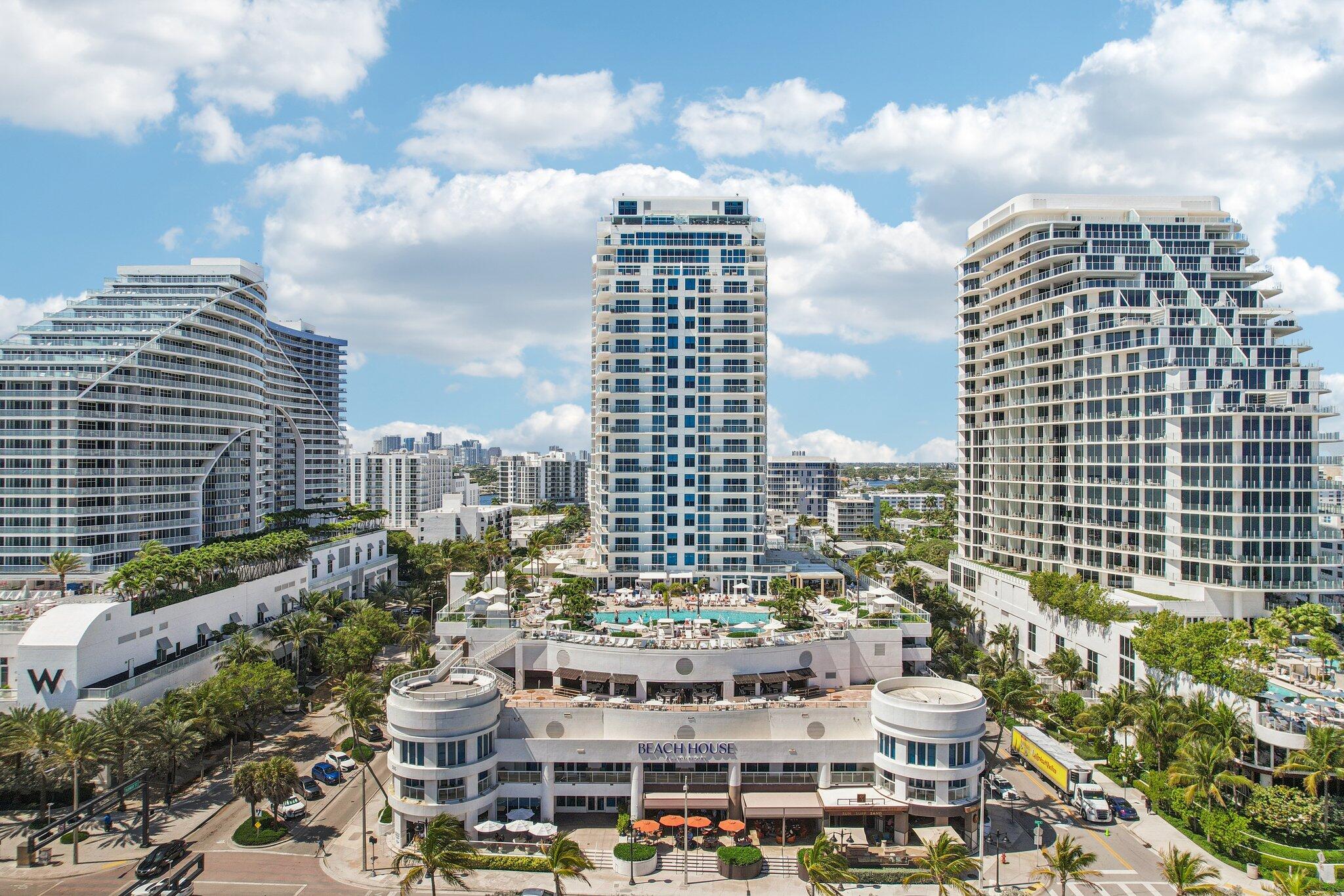 Experience effortless beachfront ownership at the Hilton Beach House Resort w/ this furnished turnkey 23rd-floor condo-hotel residence. Compact & efficiently designed, this suite offers a refined coastal retreat with breathtaking ocean views, floor-to-ceiling glass, and a private balcony to enjoy ocean breezes. Enjoy world-class resort amenities including restaurants, room service, fitness center, oceanfront pool, and direct beach access. Designed for ease of ownership, the Hilton-managed rental program while offering strong historical occupancy & revenue performance, w/ potential upside through enhanced revenue structure opportunities. A smart alternative to larger, higher-maintenance residences, delivering luxury beachfront living w/ efficiency, convenience & income potential.
