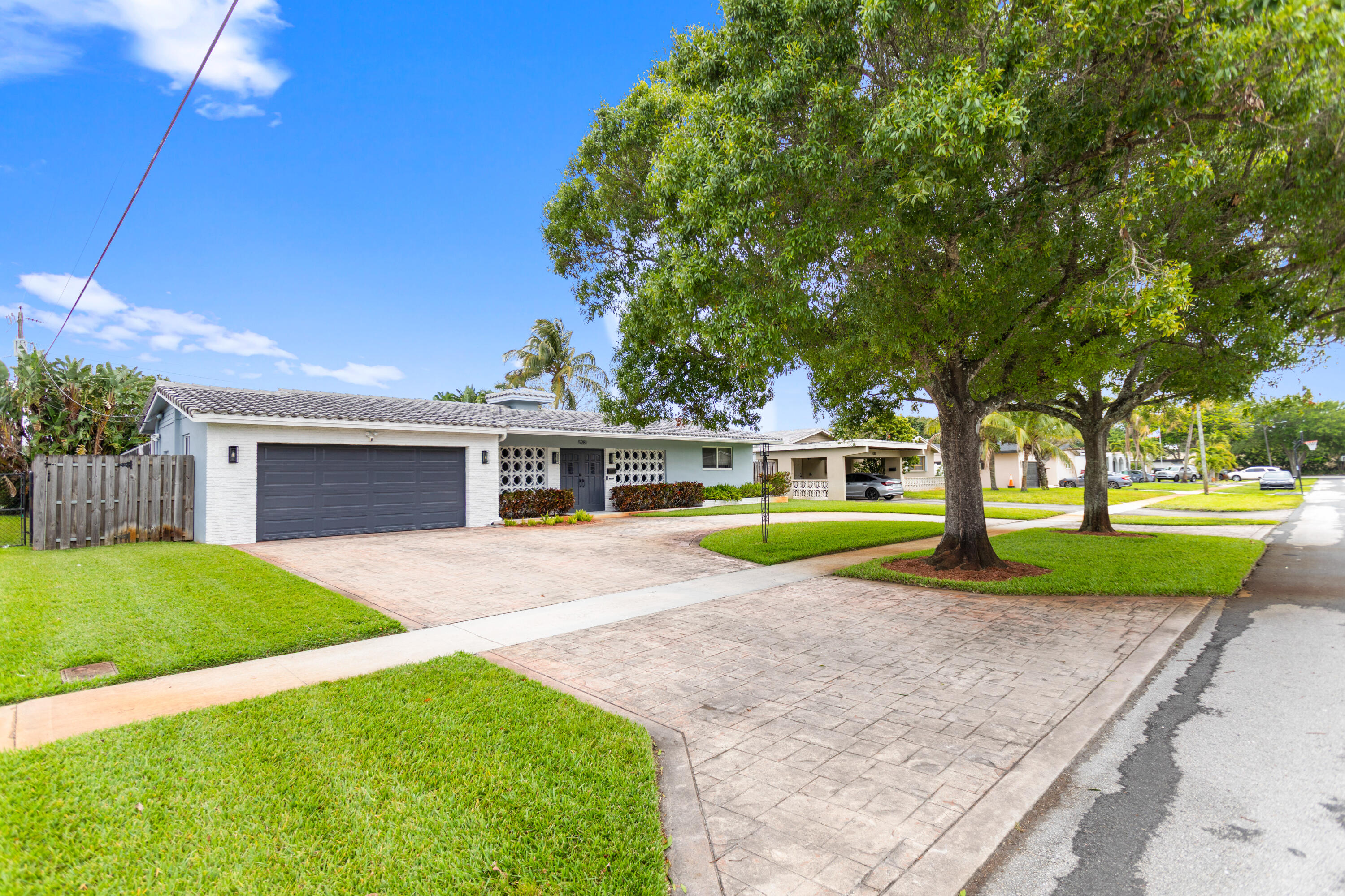 Meticulously maintained 3-bedroom, 2-bath pool home featuring screened patio, oversized/finished 2-car garage, and stamped concrete circular driveway. Fully hurricane-ready. All windows/doors are impact-rated. Backup power with a generator interlock system. Yard is fenced with mature landscaping and well-fed irrigation. Kitchen and bathrooms are fully updated with soft-close cabinetry. Kitchen has Blue Pearl granite countertops and matching backsplash. Other upgrades include new carpets in bedrooms, and surround sound wiring. Smart features: biometric locks, integrated security system with cameras, and smart thermostat. 2026 pool pump, 2022 garage door and opener, 2018 A/C, 2014 electrical panel, 2014 gas water heater,2004 tile roof, not in flood zone, ALSO available for lease: $4,600/m.