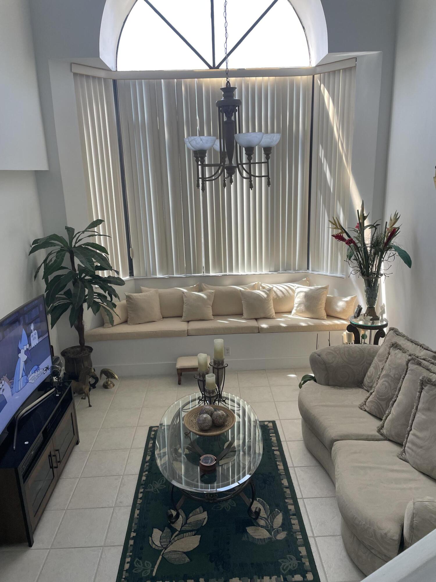 RECENT PRICE REDUCTION. CELEBRATION POINT IS RESORT STYLE LIVING, LUSH TROPICAL FOLIAGE IN THE HEART OF MIAMI LAKES! VERY RARE TWO STORY THREE BEDROOM HOME. HIGH VAULTED CEILING WITH A  HUGH BAY WINDOW OVERLOOKING THE LAGOON & GREENBELT.JUST BRING YOUR FURNITURE & PERSONAL EFFECTS: TRULY MOVE IN READY HOME.OWNER WILL PAY OFF ASSESSMENT FOR BRAND NEW ROOF AT CLOSING (A SAVING OF APPROXIMATELY $8,000).OWNER WILL GIVE BUYER A CREDIT OF $1,500 AT CLOSING TO BUY A NEW WASHING MACHINE/CLOTHES DRYER & DISHWASHER. NEUTRAL CERAMIC TILE & ONE YEAR YOUNG LIGHT NEUTRAL LAMINATE FLOORING IN ALL BEDROOMS & FOYER.REFRIGERATOR, STOVE & MICROWAVE ARE ALL 1.5 YEARS YOUNG. DINING ROOM OFF OF KITCHEN. KING SIZE MASTER BEDROOM WITH WALK IN CLOSET.THREE CEILING FANS (2 ARE 1 YEAR YOUNG). REALLY PRICED TO SELL