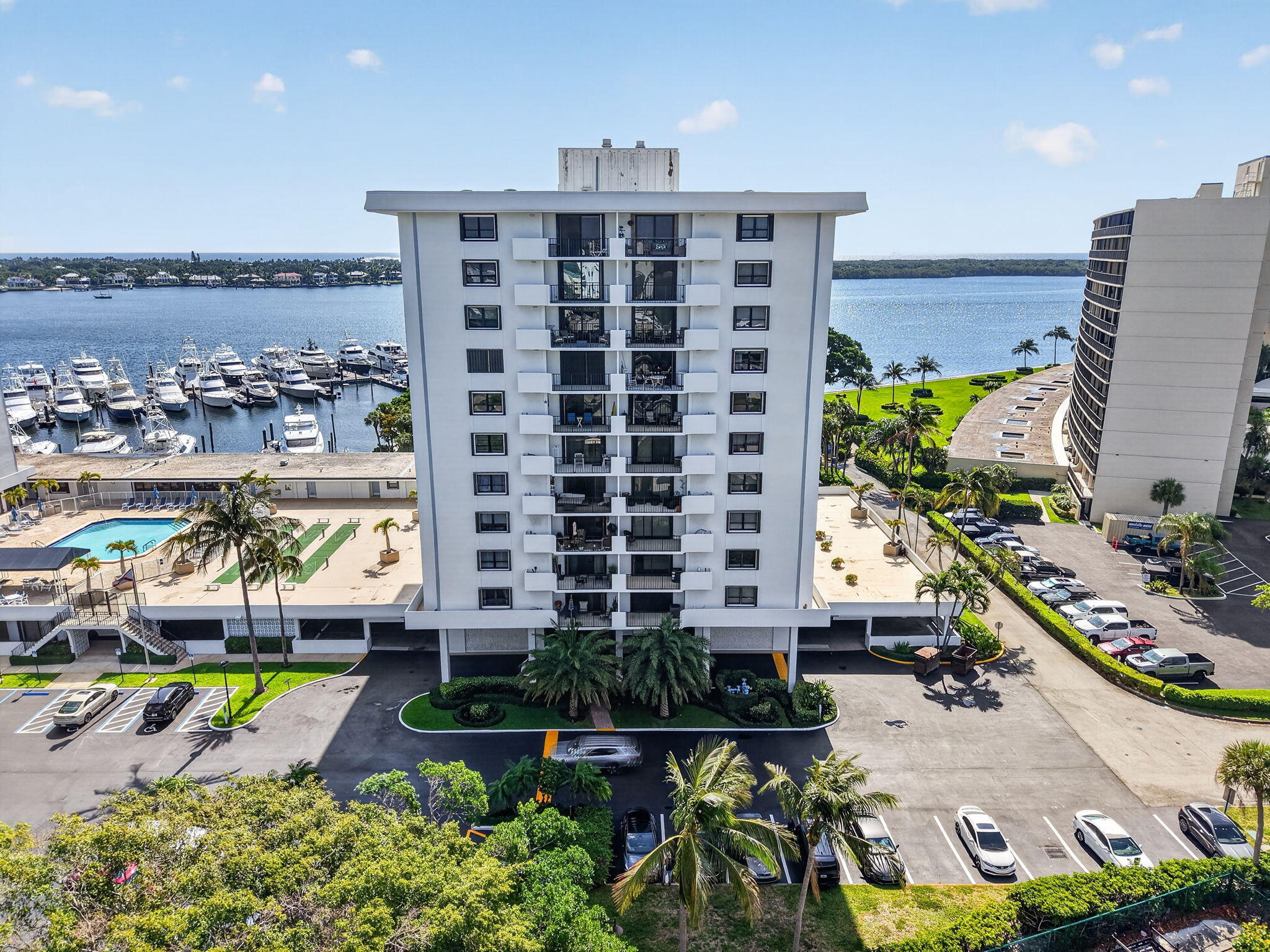 Renovated & thoughtfully designed, bright corner 1/1 in Old Port Cove's Admiralty Bldg. offers effortless coastal living w/ a highly desirable deck-level location. Sliders open directly to the community pool, w/separate & new patio creating a seamless indoor-outdoor lifestyle. Natural light enhances the open layout & highlighting the clean finishes throughout. In addition to the spacious primary living area, a versatile extra room used either for a DEN, OFFICE OR ADD'L STORAGE. Walk-in closet w/ shelves & poles & add'l. Primary closet.  Combining convenience, style, & functionality in one of NPB's  most established waterfront communities, with easy access to marina views, walking paths, & nearby dining & shopping. it delivers both comfort & location in one refined package.   Not a senior community.