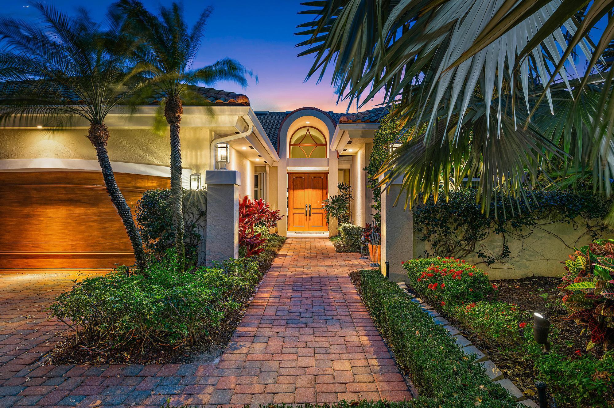 Discover your dream waterfront lifestyle at 263 Regatta Drive! Nestled in the prestigious community of Admirals Cove, this extraordinary villa offers the epitome of luxury living with breathtaking long water views. This expanded villa spans 3,256 feet and offers 3-bedrooms and 4-bathrooms, a flex living room, dedicated den/office and a 2.5-car garage. 

Volume ceilings and abundant natural light welcome you into this meticulously maintained home. The open-concept design offers both formal and casual dining options, perfect for any occasion. Relax in your living room with an evening cocktail while taking in the expansive water views. The chef-inspired gourmet kitchen boasts white shaker-style cabinetry with custom display cabinets, granite countertops, a gas stove, and a Sub-Zero refrigerator. 

To the right of the entrance you will find the spacious primary suite, featuring his and hers walk-in closets with built-ins, a gorgeous accent wall with custom wainscoting, wood flooring, an updated modern-style primary bathroom with double vanities, granite counters, custom lighting and a luxurious floor-to-ceiling tiled walk-in shower. The split floor plan ensures privacy for your guests, with each bedroom featuring its own en-suite bathroom. One guest suite offers a true retreat, complete with a private living roomso comfortable, your guests may never want to leave!

Step outside to your private oasis, featuring a screen enclosure, heated pool and spa, and a sun deck on the dockperfect for soaking in Florida's breathtaking sunsets. Set sail with ease from your own PRIVATE dock, which accommodates boats up to 40 feet. Just minutes to the ocean with no fixed bridges!

Admirals Cove offers world-class amenities, including 45 holes of golf, a private marina with ocean access, and an exclusive yacht club. Residents enjoy a luxury clubhouse, five restaurants, a state-of-the-art fitness center & spa, tennis and pickleball courts, and a full social calendar. With 24/7 manned gated security, this prestigious waterfront community provides an unmatched blend of recreation, relaxation, and privacy.