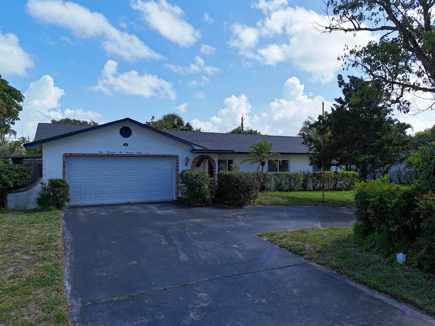 Full Roof installed July 2026. On .24 acres. Spacious 3/2 home with huge den/family room and an additional screened in patio.  HOA free neighborhood. Big eat in kitchen. Kitchen island. Trac lights in kitchen. New washing machine and new water heater. Laminate floors in dining and living room. This is a great home for the price. Freshly painted inside and new carpet in bedrooms. Fenced yard.
