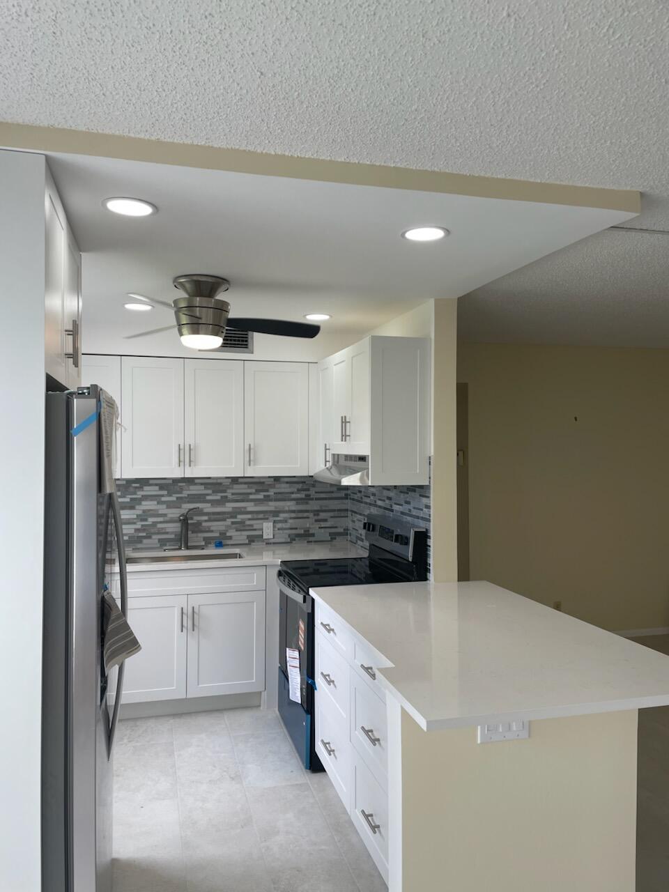 Beautifully renovated 2-bedroom, 1-bath condo available for rent! This move-in-ready residence features a modern kitchen with brand-new appliances, a fully updated bathroom, stylish porcelain tile flooring throughout, and new vertical blinds. The bright and spacious layout offers comfortable living with a clean, contemporary feel.  Enjoy resort-style amenities including a swimming pool, fitness center, sauna, tennis courts, and many additional community features. Conveniently located near shopping, restaurants, major highways, and everyday conveniences.  Experience comfortable, maintenance-free living in this beautifully updated condo. Schedule your showing today!