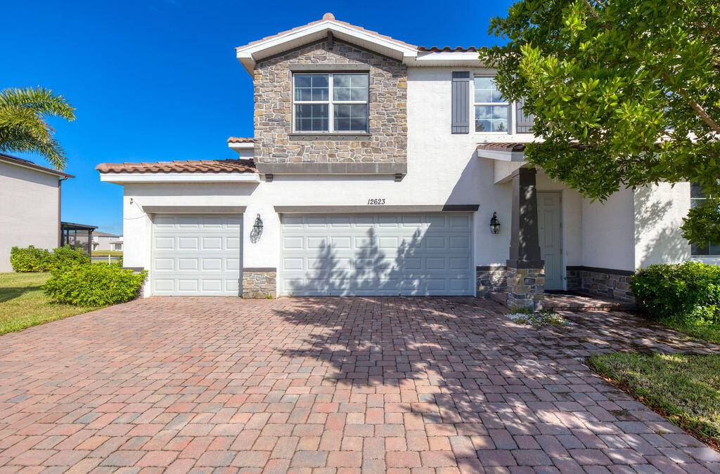 Desirable Helena model in gated, lakefront Copper Creek - perfect for entertaining or a growing family with tons of flexible living space. Gorgeous light, bright interior with upgraded plank tile flooring, designer fixtures and impact windows. Stunning kitchen features an impressive walk-in pantry. Spacious primary suite includes custom built-in closets. Assumable 4.3% mortgage available for qualified buyers! Downstairs offers open living/dining, office, guest bath and 3-car garage with a large backyard overlooking the lake. Upstairs you'll find a generous loft, additional bedrooms, laundry and 2nd full bath. Community perks include a resort-style pool, clubhouse, state-of-the-art fitness center, playground and more. Close to shopping, dining, highways and Allapattah Flats K-8.