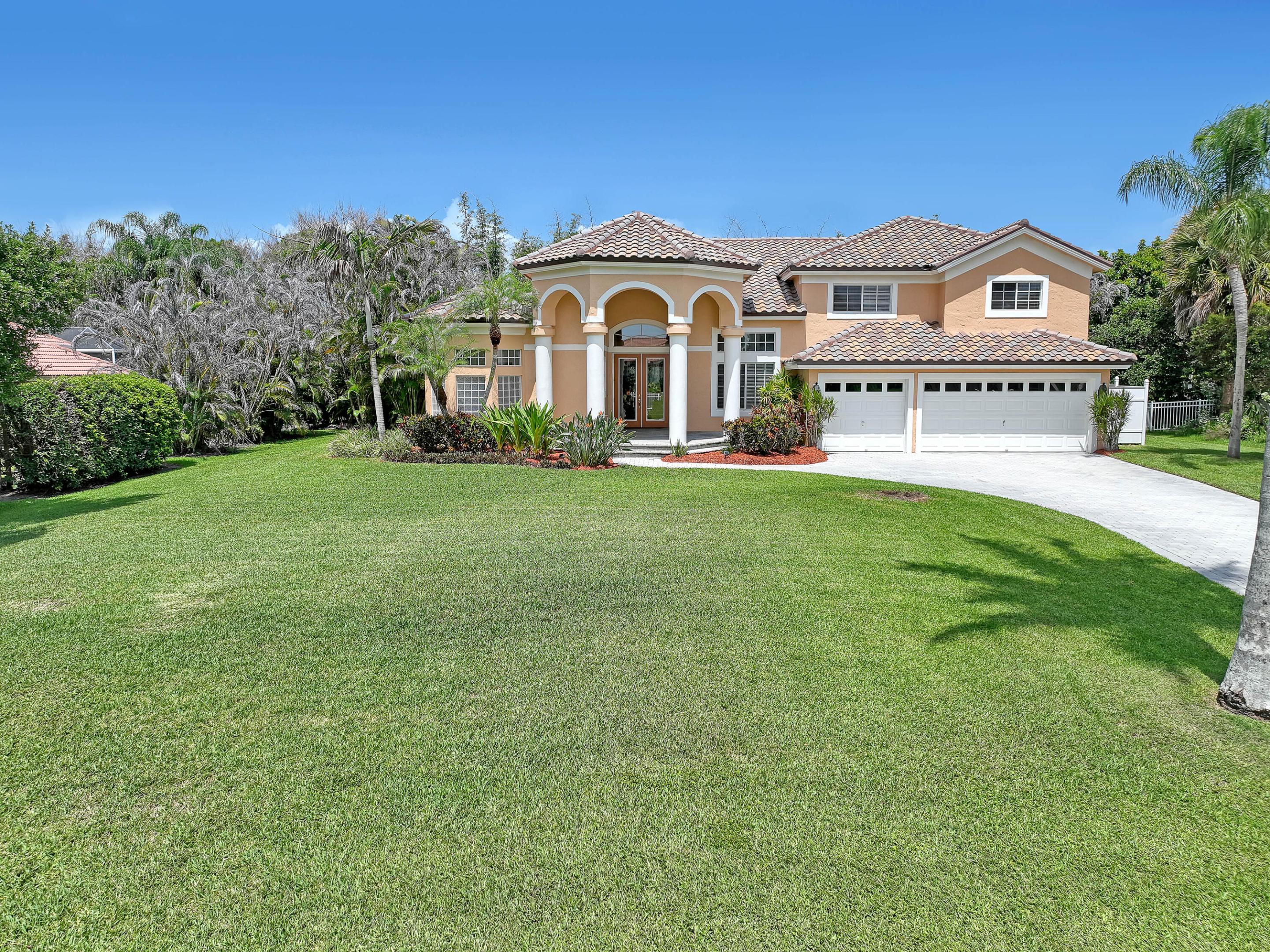 Welcome to this exceptional CBS 5-bedroom, 3-bath estate nestled on a beautifully manicured half-acre homesite overlooking the 17th tee and the 16th green all in the highly sought-after gated community of Cobblestone. Thoughtfully updated with a new barrel tile roof (2023) and extensive recent improvements, this meticulously maintained home offers the peace of mind today's Florida buyers are looking for. A sweeping paver driveway framed by stately Royal Palm trees creates a grand first impression before welcoming you through elegant glass double doors into a bright, open floor plan featuring soaring vaulted ceilings, abundant natural light, and 3,274 square feet under air (4347 square feet total) designed for comfortable everyday living and effortless entertaining. The home offers an elegant living room, spacious family room, beautifully appointed dining room, and a bright eat-in kitchen where you can sip your morning coffee while overlooking your private tropical backyard retreat. The dining room is perfect for holiday gatherings, special celebrations, or everyday meals while offering picturesque views of the lush front lawn and sparkling pool area. The updated kitchen features a 2025 Whirlpool range with built-in Air Fryer, 2025 Whirlpool microwave, 2021 Maytag refrigerator, dishwasher, newer Maytag washer, newer Electrolux dryer, and an updated faucet. The spacious primary suite is your private retreat, featuring a beautiful spa-inspired bath with dual vanities, a soaking tub, recently updated walk-in shower, and an oversized walk-in closet and wall closet. A first-floor guest suite with new ceramic wood-like tile has an adjacent private bath and is ideal for overnight guests or multi-generational living, while generously sized upstairs bedrooms, abundant storage, and a convenient laundry chute make everyday living easy. Step outside and enjoy your own private backyard oasis. The sparkling pool was resurfaced in 2023 and is surrounded by a redesigned, resurfaced, and freshly painted pool deck. A new pool pump and upgraded pool equipment (2025) provide added peace of mind. Spend weekends relaxing by the pool or entertaining beneath the covered patio, complete with electric for a television and your favorite music. A white safety fence, outdoor shower, mature tropical landscaping, and a privacy fence along the side yard complete this inviting outdoor retreat. Leave the crowded neighborhoods behind and enjoy the extra space that only a half-acre homesite can provide. With room for children and pets to play, gardening, entertaining, or simply relaxing in your own peaceful surroundings, this property offers the privacy and lifestyle that are becoming increasingly difficult to find. Additional updates include newer two-zone air conditioning with UV air purification, two newer hot water heaters, a new well pump with upgraded water filtration and water softener system (2025), professionally painted interior and exterior, professionally installed 3M 10-mm commercial-grade impact-resistant tinted window film, a professionally monitored security and fire alarm system, an exterior generator outlet, all new window and patio screens with updated sliding door rollers, whole house water filtration system, new carpet on the stairs and bedrooms upstairs, and an oversized three-car garage with plenty of room for multiple vehicles, a golf cart, workshop space, and recreational equipment. Beyond the home, you'll discover the lifestyle that makes Cobblestone so special. This gated community offers 24-hour guarded security with a single controlled entrance, majestic pines, sparkling lakes, protected nature preserves, spacious half-acre homesites, and abundant native wildlife. Residents also enjoy a private community park with a playground, soccer field, baseball field, and basketball courts. Golf enthusiasts will appreciate the convenience of The Cape Club, offering optional membership and access to multiple participating club locations, while the HOA is just $151 per month. You will have time to enjoy the summer in the magnificent home and you will look forward to celebrating the holidays with tons of room for guests.