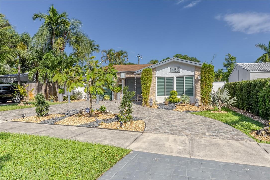 A Piece of Paradise in the heart of East Hollywood~Award Winning House of the Month in Hollywood Lakes ~3 Bedrm 2 .5 Bath Plus a Den (can easily be a 4th bedrm)~Outside Summer Kitchen w/ Granite Counter, Dbl. Sink~Dining and living areas Seating for 24~Boutique resort style at its most elegant; Shower/Bath,Self-Watering Sink;New Salt Water Heated Pool Jandy/Aqualink; LED Lights~New Pavers throughout ~Beautiful Landscaping~Dbl glass entrance, hurricane proof Doors/windows; New Porcelain Tile in Living Areas with New Wood Floors in Bedrooms~Completely Updated~Newer TRANE A/C with a separate a/c split in master bedr/ New Kitchen w/Slate Counters,SS Appliances, Dbl. Pantry, New Electrical Panel/Main Water Pipe System, LED lighting inside and out~Freshly Painted; All backyard furniture included Dream home at Hollywood, East of US1; Minutes from famous Hollywood Boardwalk and Beach; The house features Resort style outdoor space with a covered pergola in the living room area; Modern artificial grass covered wall with mounted 55"TV.  Gas grill at outdoor kitchen with great space for entertainment;  Open Floor-plan with lots of natural light. Ample closet space; The master bath has double bowl glass sinks, spacious shower with stone tile; Laundry room; Hurricane impact windows and doors; Double French style door that leads to the backyard. double gate to the alley, Side gate entrance with lock; Artificial grass throughout the pool deck area plus outdoor carpeting on both sides of the house for easy maintenance; Fence throughout the property; professional landscaping;Close to Fine Dining, Downtown Hollywood, The Gulfstream Park; Aventura Mall, Whole Foods, Target and supermarkets; Close to Miami and Fort Lauderdale Airports with easy access to main I95