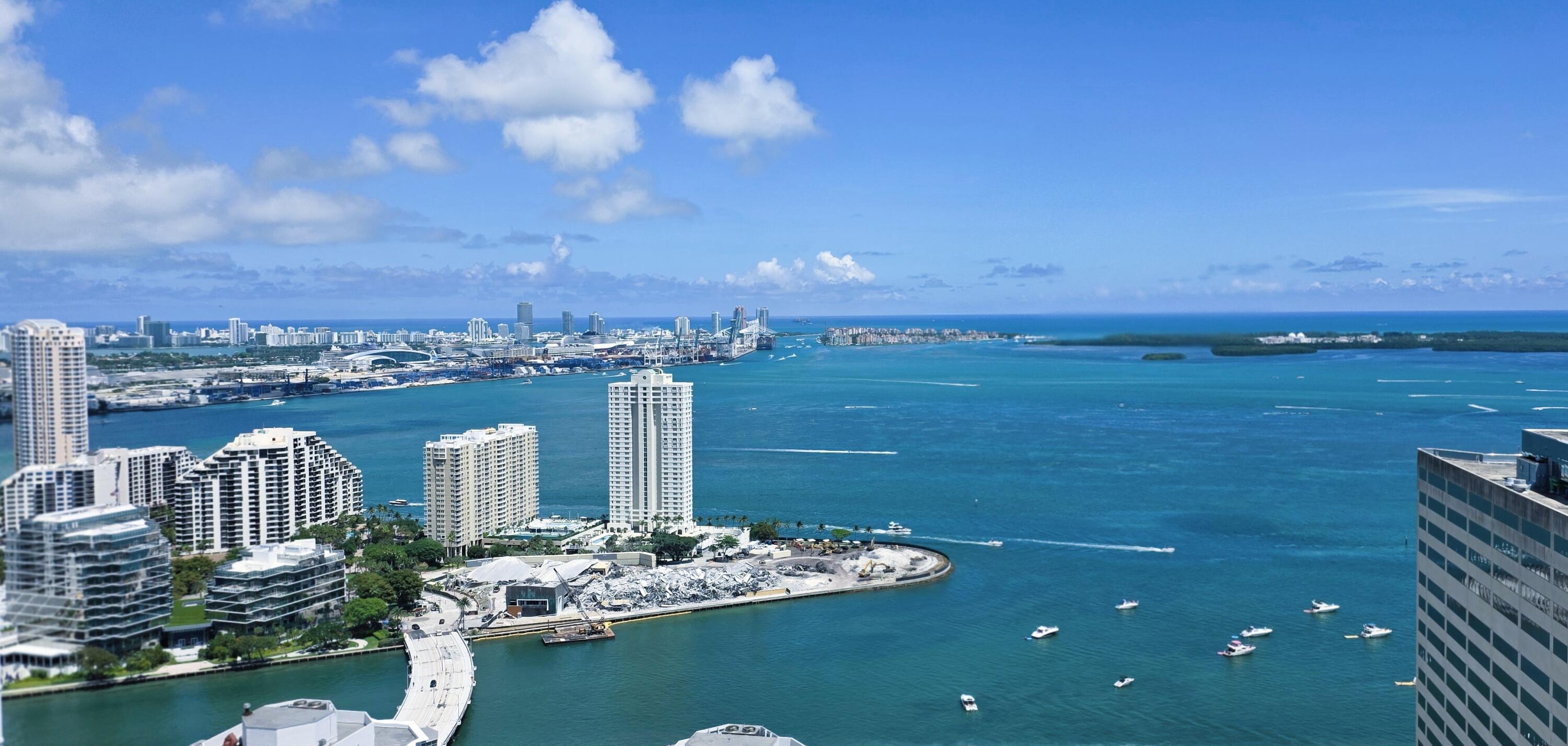 Beautifully designed 2-level Penthouse with spectacular water views from every room. 2 bedroom, 2 1/2 bath with 11 ft ceilings on the first floor and 10 ft ceilings on the second floor. Amazing designer finishes including high-end kitchen appliances, custom closet cabinetry, LED lighting / accent lighting,  electric curtains & shades, and much more. Located in the heart of Brickell with the best restaurants and entertainment in Miami, this gorgeous penthouse feels like a private home in the sky. This pet friendly building has great amenities, security, friendly staff.  Furniture negotiable.    Situated on the 43rd floor, this residence offers 1,436 square feet of finished living space, providing an open floor plan ideal for modern living. This condominium presents an excellent opportunity for those seeking a well-appointed residence in a prime Miami location with plenty of vertical space and refined finishes throughout. Very private, water and basic cable / internet included. Plaza on Brickell is a great building to be in.