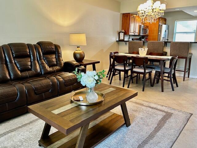 Beautifully updated 2-bedroom, 2-bath residence located in the desirable 55+ community of Oriole Gardens, offers a vibrant, amenity-rich lifestyle for Low HOA fee paid quarterly. This ground level unit is one of the best values in the area — complete with impact windows, bright, spacious, and ready for its next owner. Furnished, open concept kitchen, recessed lighting, a living room fire place, marble floor and counter tops in the bathroom and smooth ceilings. A must see! Prime Location: Conveniently situated near shopping, and major roads — everything just  minutes away while still enjoying a quiet, residential setting. Resort-style Heated swimming pool, Clubhouse with game room, active social activities and events space, Fitness area, Landscaped grounds with serene pathways and gardens. New Roof, Electric fire place, marble floor and counter top in the bathroom, stainless steal appliances, modern tile throughout, recessed lighting, smooth no popcorn ceiling. Extra exterior storage unit. Sold furnished with some exceptions.