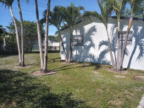 Get this beautiful 3/2 home with a bonus room that can be used for a den/office or guest room, only 6 mins from the beach and sits on a huge fenced in corner lot. This home has new granite kitchen with all new stainless-steel appliances along with new washer and dryer. New tile throughout the home to go along with new paint inside and out. Room for a pool or for an addition to the existing home and plenty of parking (4 cars) on the driveway. This home has everything that you would want east of 95 in Palm Beach County.