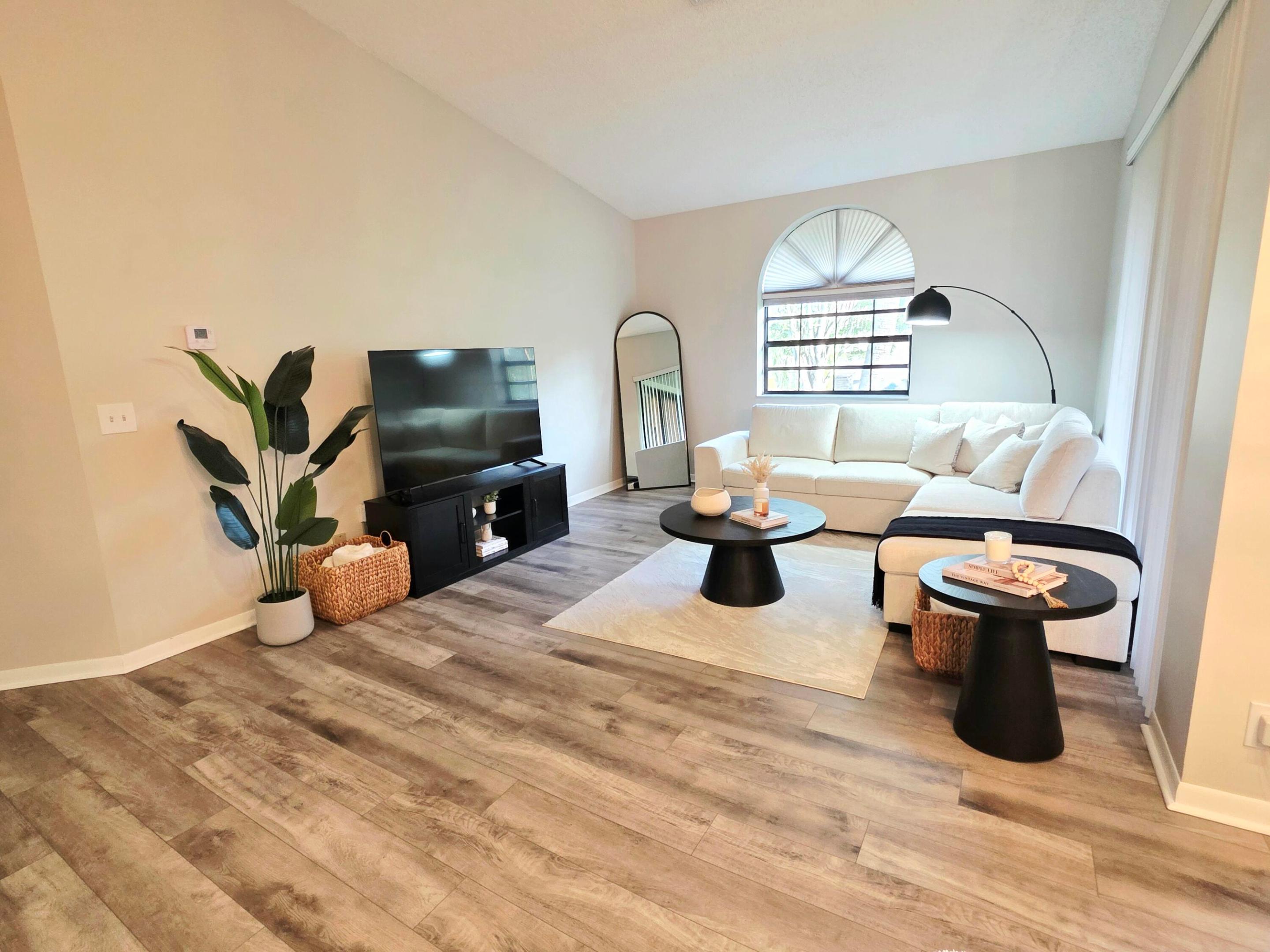 Welcome to resort-style living in the highly sought-after Platina community of Boynton Beach. This beautifully updated 2-bed, 2-bath condo offers the perfect combination of comfort, style, and exceptional value. Step inside to discover recently installed flooring, a beautifully updated kitchen featuring stainless steel appliances and modern finishes, and a 2025 A/C system, providing peace of mind for years to come. The spacious layout is designed for effortless everyday living and entertaining. The monthly association offers outstanding value by including fiber-optic high-speed internet, bulk cable with HBO, Wi-Fi, water, Roof and exterior maintenance, and an annual $225 dining credit to enjoy at the community's on-site café and restaurant.  Platina is renowned for its exceptional resort-style amenities, featuring a spectacular main pool, a second private pool, spa, sauna, tennis and pickleball courts, and a state-of-the-art fitness center overlooking the pool. The elegant clubhouse serves as the social hub of the community, offering year-round activities, entertainment, and dining just steps from your door. Whether you're searching for a full-time residence or a seasonal retreat, this move-in-ready home offers the ideal South Florida lifestyle. Don't miss this exceptional opportunity to own in one of Boynton Beach's most desirable active communities—schedule your private showing today.