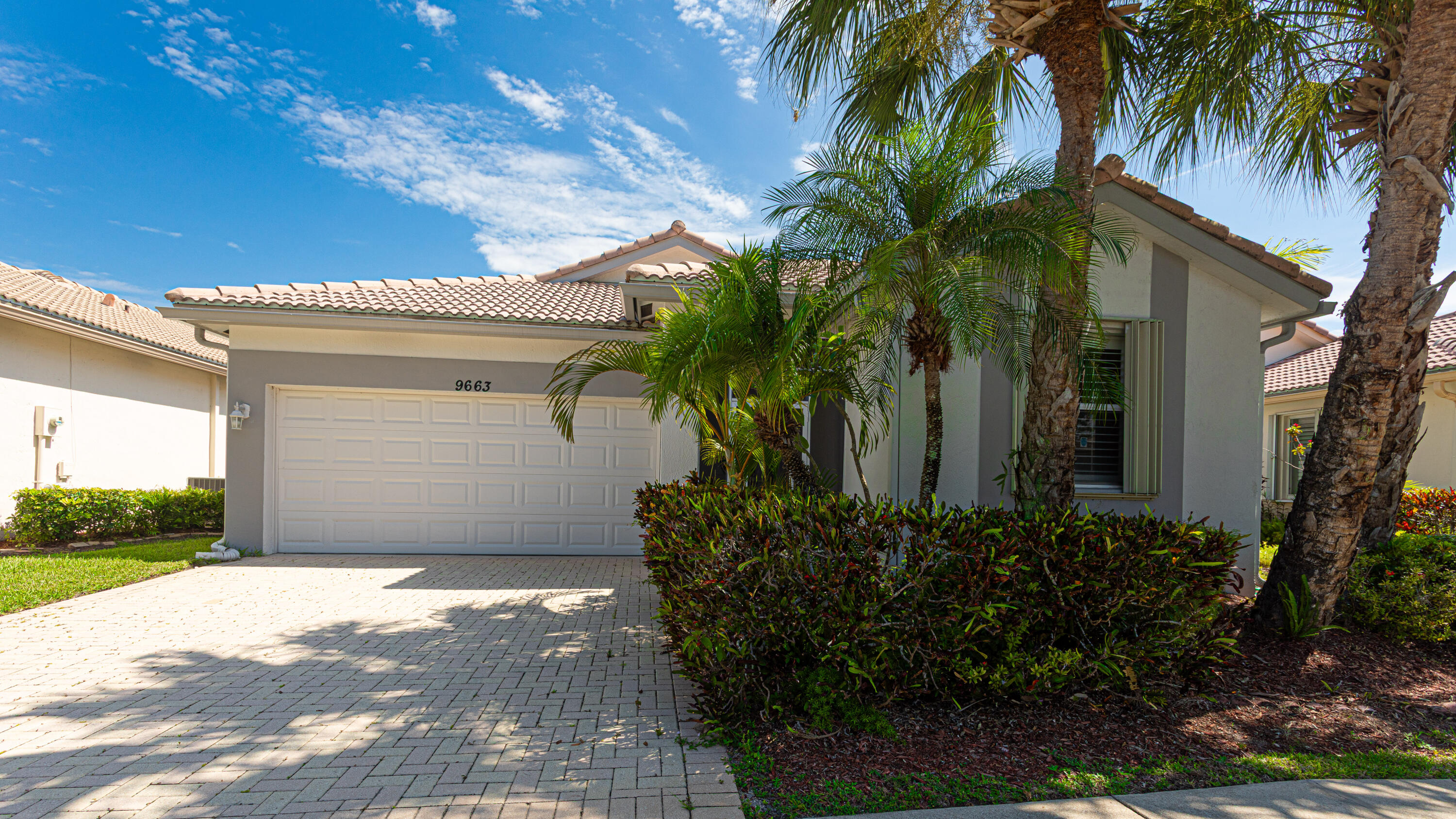 Move-in ready 3-bedroom, 2-bath single-family home in the beautiful 55+ active-adult community of Baywinds in West Palm Beach. This well-maintained residence offers a bright, comfortable layout with generous living spaces, a renovated kitchen, and a fully renovated primary bathroom featuring a Jacuzzi-style tub. The home has been lovingly cared for and includes interior laundry, convenient garage access through the laundry room, a 2-car garage, a spacious paver driveway, and a screened patio for relaxing outdoor living.  Baywinds offers a true resort-style lifestyle with a fully staffed clubhouse, Social Director, swimming pools, resistance-walking pool, hot tub, fitness center, aerobics room, tennis, pickleball, bocce, shuffleboard, billiards, library, media room, ballroom, card rooms, craft room, clubs, activities, and beautifully maintained surroundings. The community is centrally located near shopping, dining, Downtown West Palm Beach, Florida's Turnpike, I-95, Palm Beach International Airport, and approximately 10 miles from the Atlantic beaches. A wonderful opportunity to enjoy comfort, convenience, and the Baywinds lifestyle.
