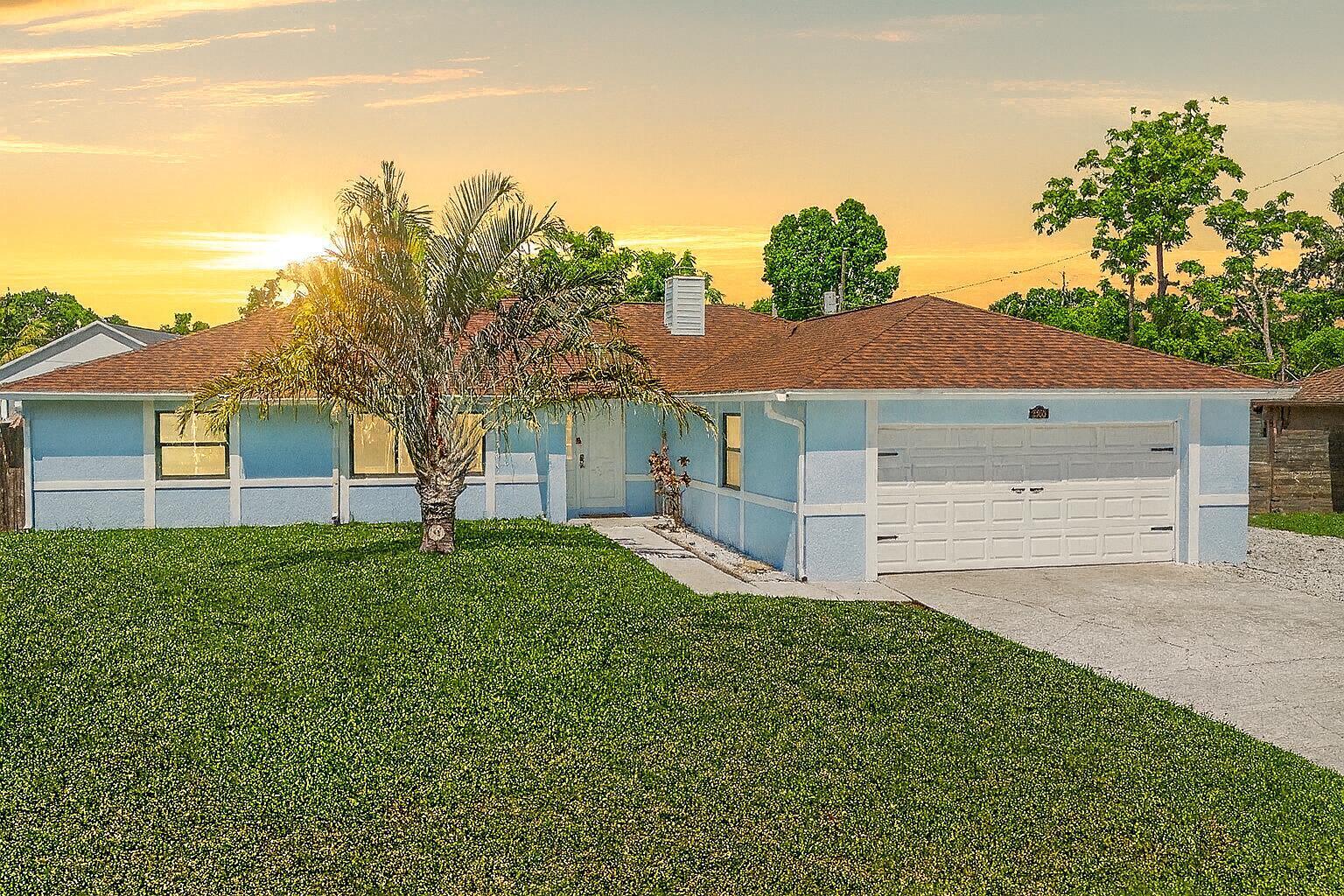 Welcome to 2350 Fallon Blvd, where elevated island living meets freedom and affordability. Situated on an oversized lot with no HOA, this tropical-inspired retreat offers the relaxed Florida lifestyle relocation buyers are searching for. Inside, soaring cathedral ceilings, abundant natural light, impact windows/sliders, and an open split floor plan create an airy coastal feel. Step outside to lush landscaping, a custom pergola, fire pit lounge, and outdoor shower designed for entertaining and unwinding. Rare oversized side-yard parking provides plenty of room for a boat, RV, trailer, or future pool. Conveniently located near I-95, beaches, dining, and outdoor recreation.