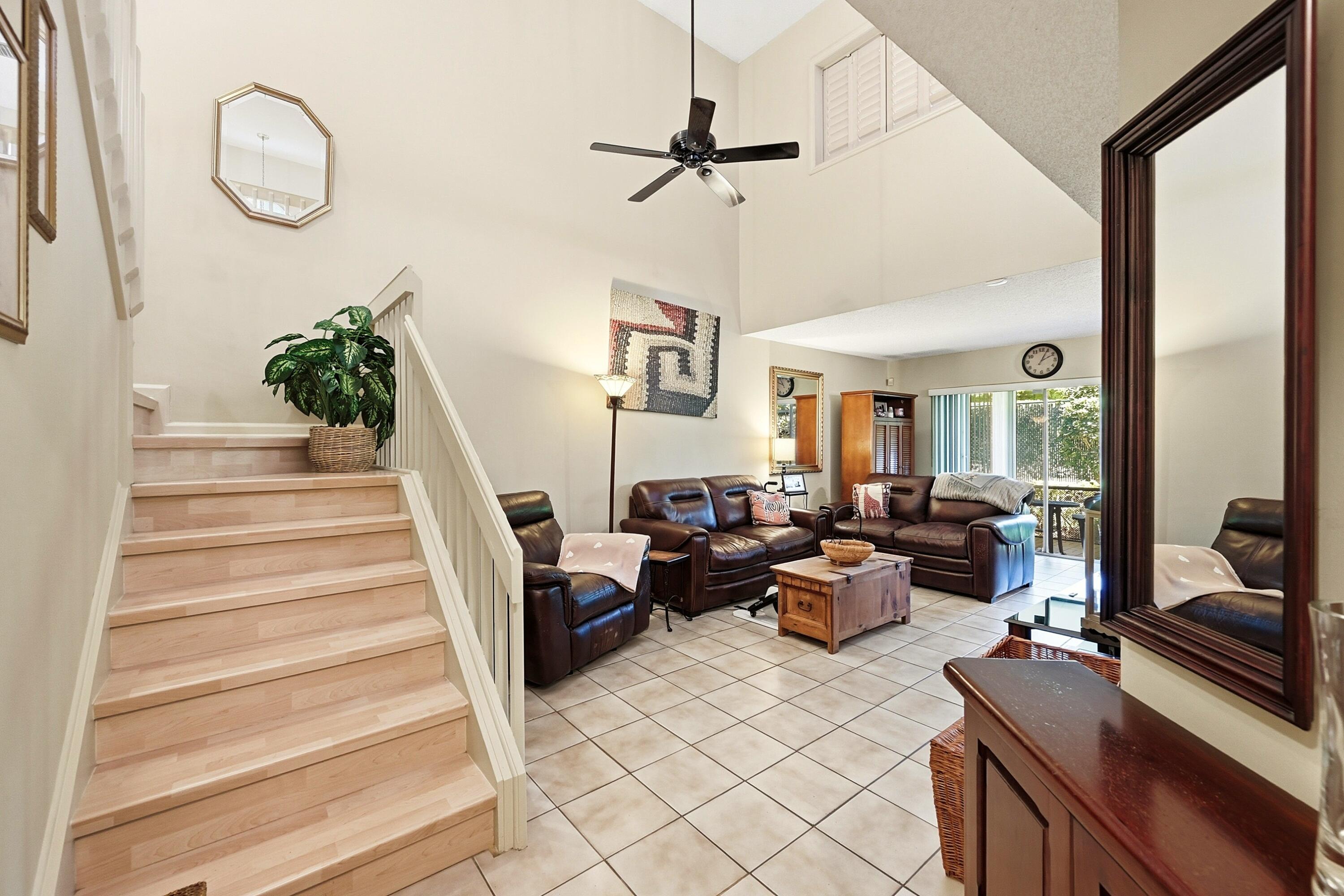 Welcome to Discovery Pointe in Deerfield Beach! This spacious 3/2 corner unit home offers extra privacy, abundant natural light, & a desirable floor plan w/ the primary suite upstairs. Updates include SS appliances, washer/dryer, &A/C (2021), accordion shutters throughout & laminate flooring upstairs. Ample parking including driveway, garage, assigned spot right outside the unit & plenty of guest parking. Enjoy resort-style amenities including a gated entrance, pool, gym, tennis courts, playground, & fishing dock. Investor-friendly community w/ no approval process, no minimum credit score requirement, & immediate rentals allowed. Conveniently located near shopping, dining, major highways, parks, and Deerfield Beach's beautiful beaches. Perfect as a primary residence or investment property!