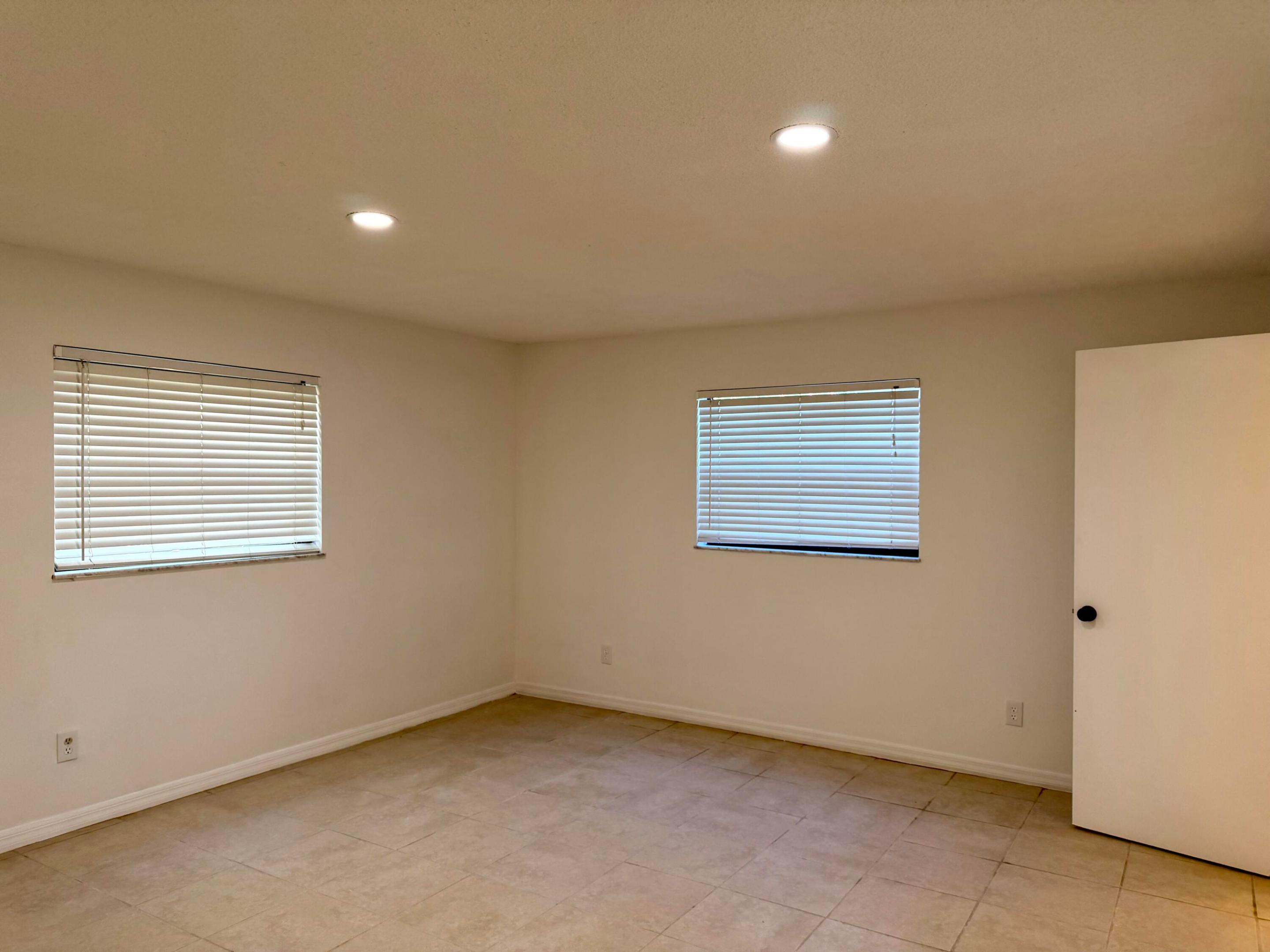 Come see this spacious freshly painted first floor end unit in Oak Park Terrace. The unit has tiled floors, expansive dining area & open living room concept which leads to a soothing tropical retreat overlooking a screened porch with accordion hurricane shutters.  Both bedrooms are large with a walk-in closet in the main BR.  Also located within walking or biking distance to  shopping, restaurants and over the bridge to South Beach. This unit is located away from the street in a quiet area near the pool and clubhouse. Great east west exposure for wonderful breezes. Pool was just resurfaced and the roof is new as well.   Pool and tennis in this 55+ comm.