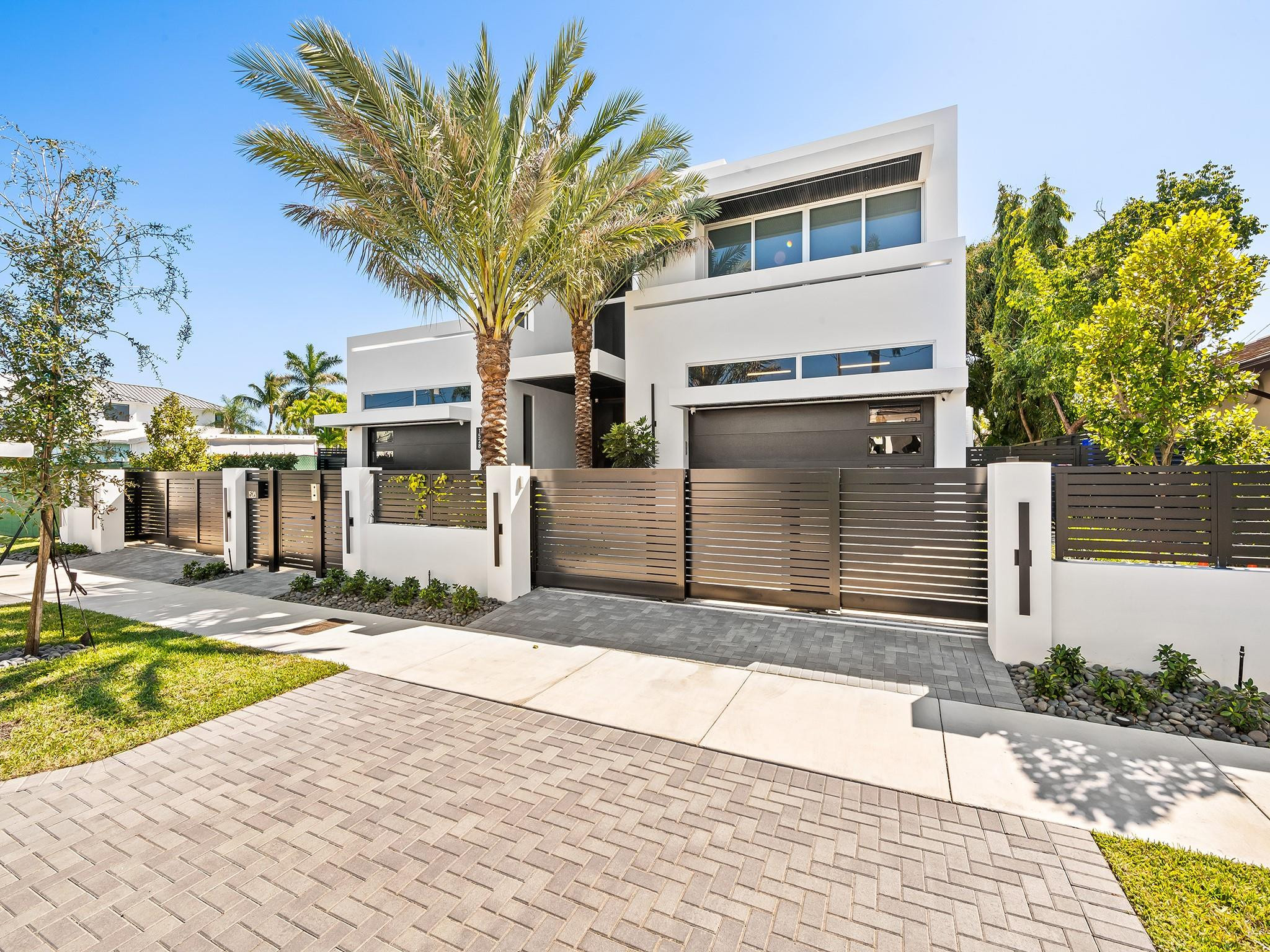 PRIME HISTORIC RIO VISTA LOCATION! NO FIXED BRIDGE SOUTHERN EXPOSURE! BACK YARD FACES PREVAILING SEA BREEZES AND PRIME SUNSHINE YEAR ROUND!  ONE BLOCK TO THE YACHT CLUB! BRAND NEW CUSTOM CONTEMPORARY WITH SUPER PREMIUM FINISHES! WALLED AND GATED COMPOUND! 5 CAR GARAGE! 75' OF PROTECTED DOCKAGE JUST 5 MINUTES TO PORT EVERGLADES! SUPER WIDE CANAL, 125' ACROSS! POTENTIAL TO PURCHASE VACANT LOT NEXT DOOR WOULD GIVE YOU 150 FEET DOCKAGE! DESIGNED BY TUTHILL ARCHITECTURE & CUSTOM BUILT BY SBC CONSTRUCTION! 5 BEDROOM SUITES & 5.5 BATHROOMS AND A TOTAL OF 7,300SF OF INDOOR AND OUTDOOR AREA! EXCEPTIONAL FINISHES, TWO LAUNDRY ROOMS, MARVIN SIGNATURE COASTLINE WINDOWS, INFINITY EDGE SALTWATER POOL AND SPA, ELEVATOR, ITALIAN CABINETRY AND EXTENSIVE OUTDOOR KITCHEN AREA FOR GRAND SOUTH FLORIDA LIVING!