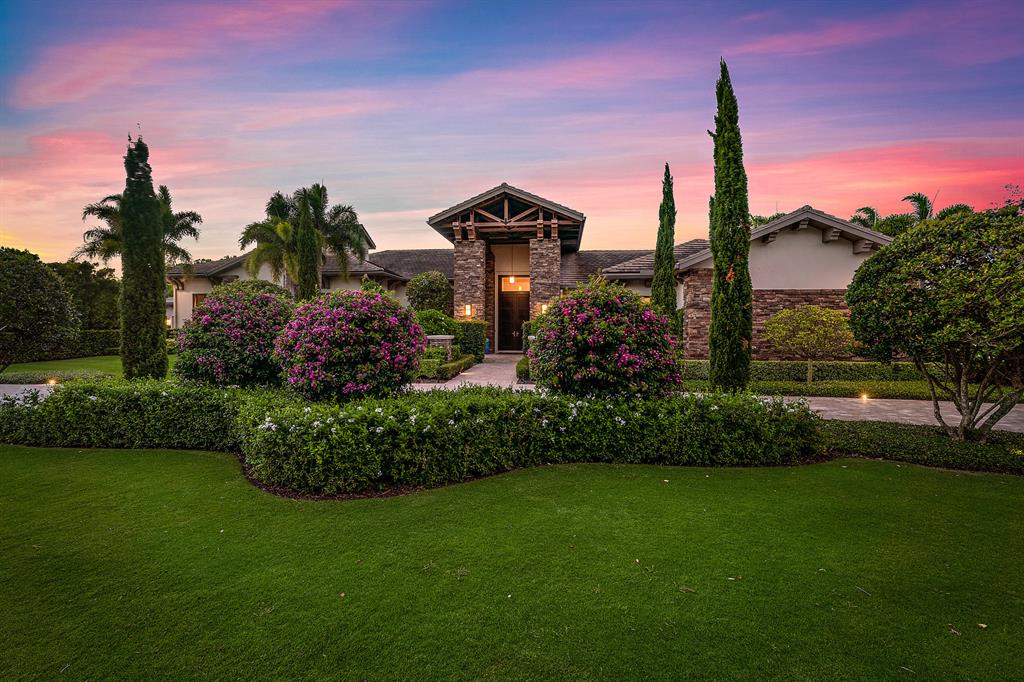 STUNNING CUSTOM ESTATE ON OVER ONE ACRE OF METICULOUSLY LANDSCAPED GROUNDS OVERLOOKING THE LAKE WITH DESIGNER FOUNTAIN FEATURE AND PRESERVE. BEAUTIFULLY APPOINTED INTERIOR WITH CONTEMPORARY TOUCHES. 7 BEDROOMS WHICH INCLUDE A PRIVATE GUEST WING WITH BREAKFAST BAR AND ENTRANCE. HIGH CEILINGS THROUGHOUT WITH WOOD BEAM ACCENTS. LARGE ENTERTAINMENT SPACE WITH GOLF SIMULATOR/THEATER & BAR. MASTER SUITE OVERLOOKING THE LAKE AND DESIGNER POOL & SPA. EXPANSIVE INDOOR/OUTDOOR LOGGIA FULLY AC'ED WITH SUMMER KITCHEN & FULL BAR, FIREPLACE AND TV'S. HUGE DISAPPEARING SLIDERS OPEN THE ROOM TO POOL AND WONDERFUL LAKE VIEWS. VERY PRIVATE LOCATION WITH LARGE MOTORCADE AND CIRCULAR DRIVE. COME SEE THIS BEAUTIFUL LAKEFRONT ESTATE AND ALL OLD PALM HAS TO TO OFFER.