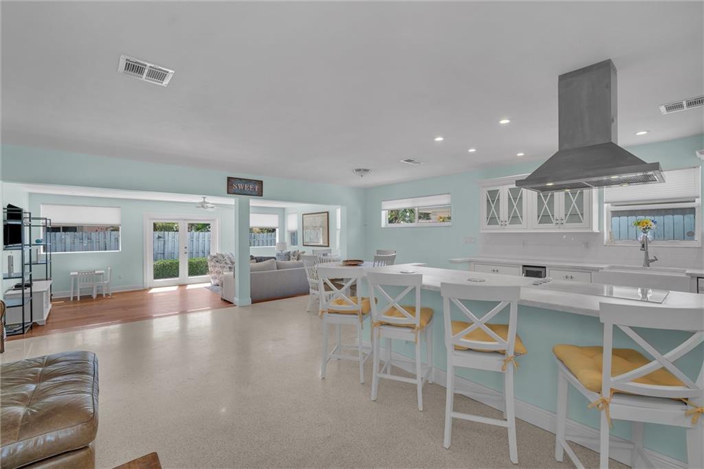 WELCOME TO IMPERIAL POINT !!  ENJOY THIS UPDATED 3 BEDROOM HOME WITH REMODELED KITCHEN & OPEN CONCEPT LIVING **LARGE FAMILYROOM OFF KITCHEN OVERLOOKS PRIVATE FENCED YARD **CHEFS KITCHEN FEATURES  NEWER WHITE  APPLIANCES  ,   MARBLE  COUNTERTOPS & A LARGE ISLAND **IMPACT WINDOWS  &  DOORS  ** LUSH LANDSCAPING ** GARAGE * INSIDE LAUNDRYROOM **WALK TO THE PARK**SIDEWALKS **CLOSE TO BEACH**iTS LOVELY !! Bring an offer !