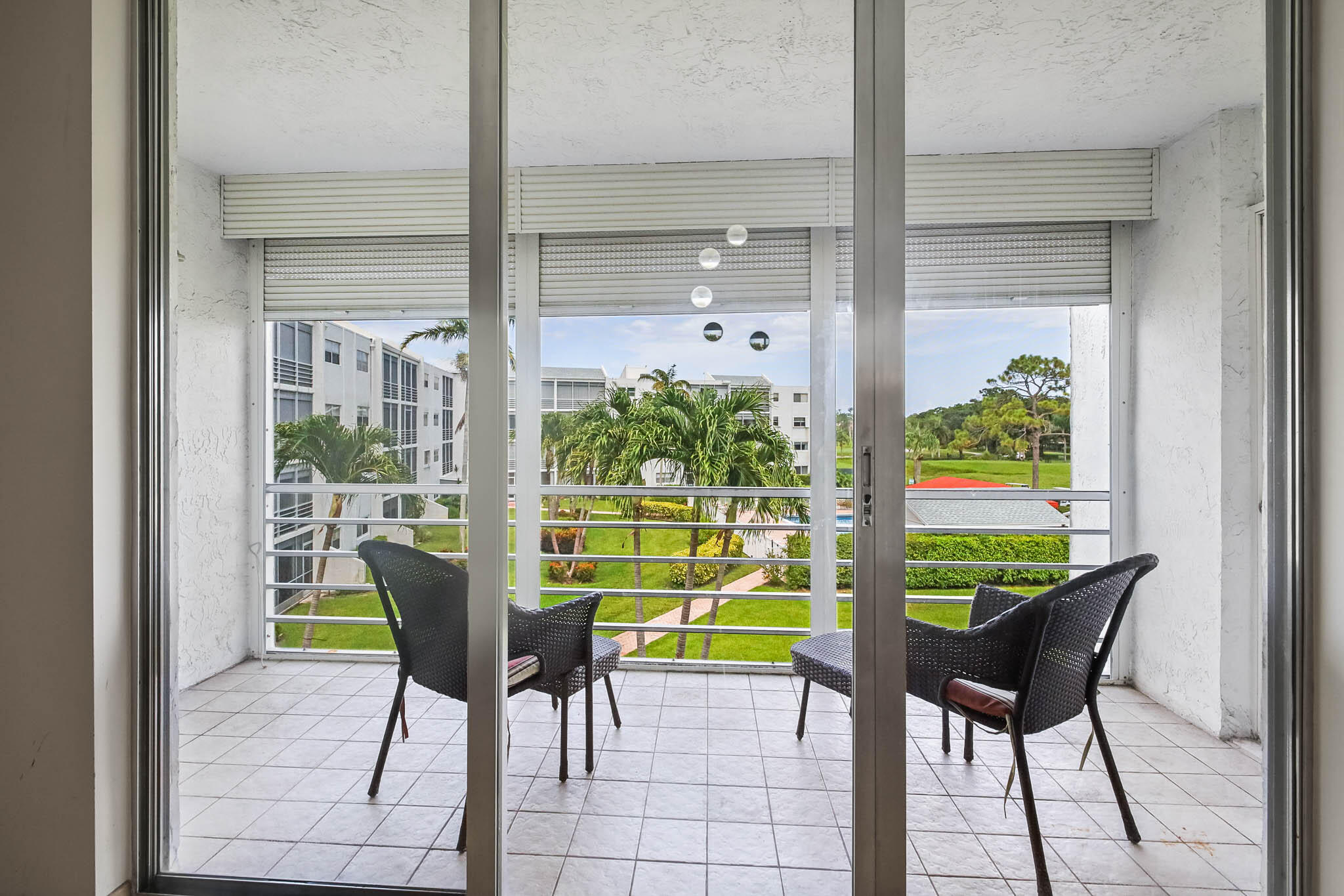 WELCOME TO THIS WELL PRICED, SPACIOUS CONDO WITH GOLF, POOL & GARDEN VIEWS! LOOKING FOR LARGE BEDROOMS, LOTS OF CLOSET SPACE, EAT-IN KITCHEN & POOL AT YOUR BUILDING? THIS IS IT!  A GREAT OPPORTUNITY TO DECORATE & FURNISH YOUR WAY. THE POPULAR CARLISLE BUILDING HAS 2 ELEVATORS (UNIT 313 IS 1 UNIT AWAY FROM THE ELEVATOR), ITS OWN POOL, 2022 ROOF, UPDATED ELEVATORS & A CONDO FEE THAT INCLUDES WATER,SEWER,WI-FI,MASTER INS.,PEST CONTROL & USE OF THE POINCIANA CLUBHOUSE WITH A POOL,GYM,PICKLEBALL,TENNIS,MEL'S BISTRO & ENTERTAINMENT & PAY-AS-YOU-PLAY GOLF! ADULT COMMUNITY.