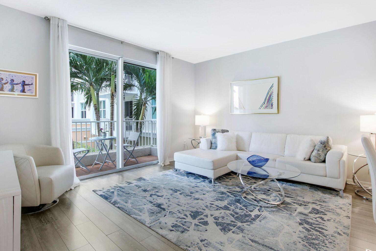 Enjoy resort-style living in this fully furnished, turnkey condo located at The Moorings in Lantana. Featuring an open-concept floor plan, vaulted ceilings, and an in-unit washer and dryer, this residence offers both comfort and convenience. The community feels like a private resort with two large heated pools, relaxing spas, a sauna, fitness center, billiards room, business center, and a clubhouse perfect for hosting events. Rent includes water, cable, and internet for added value. Ideally situated east of Federal Highway and adjacent to the Intracoastal Waterway, you'll enjoy easy access to waterfront dining, beaches, shopping, and entertainment.