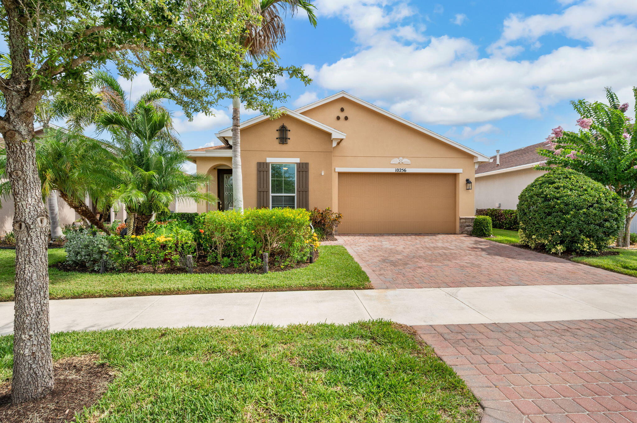 This home features an open-concept layout with two bedrooms, two bathrooms, and a versatile den. Key highlights include tile floors, a large kitchen with 42-inch cabinetry, impact windows and doors throughout, and a primary suite with a walk-in closet and shower. The property also offers a beautiful backyard with a screened porch.  Recent upgrades include modern stainless steel appliances, a water softener system, a new AC unit (2023), and a new water heater (2025). Additionally, residents enjoy access to resort-style community amenities, including a fitness center, pool, pickleball and tennis courts, and more.