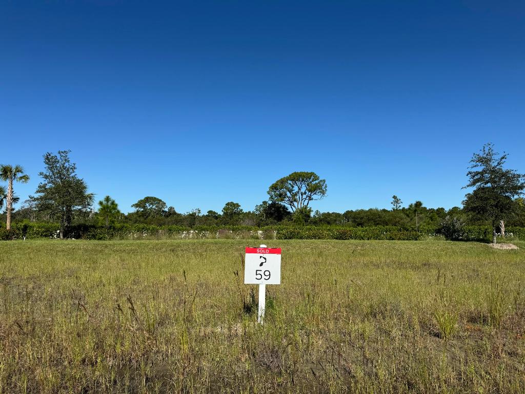 Surrounded by a 2,400-acre nature preserve, this stunning half-acre custom homesite offers unparalleled privacy and breathtaking views. Set within the exclusive Panther National Golf Club—home to Florida's recently rated #1 residential golf course—this property presents a rare opportunity to custom design and build your dream home in one of the most extraordinary settings.  Experience the ultimate in luxury living at Panther National Golf Club.