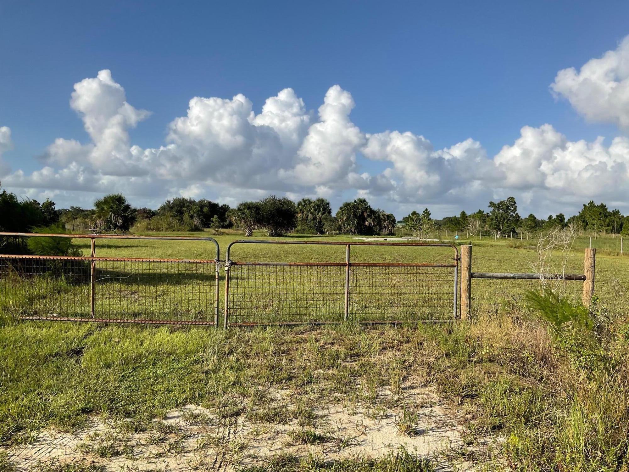 Kissimmee River Prairie- Build the home of your dreams on this amazing 1.25-acre parcel. Upgrades include Cleared, fenced, three gated entrances, two concrete pads, 45' x 45', & 15' x 20', Well with Pump & pressure tank, Shell rock driveway, culvert, and a Huge Shooting berm! Whether you are looking to escape your busy city life, Build the home of your dreams, or just a weekend getaway, Look no further!  all measurement approximate. Call today