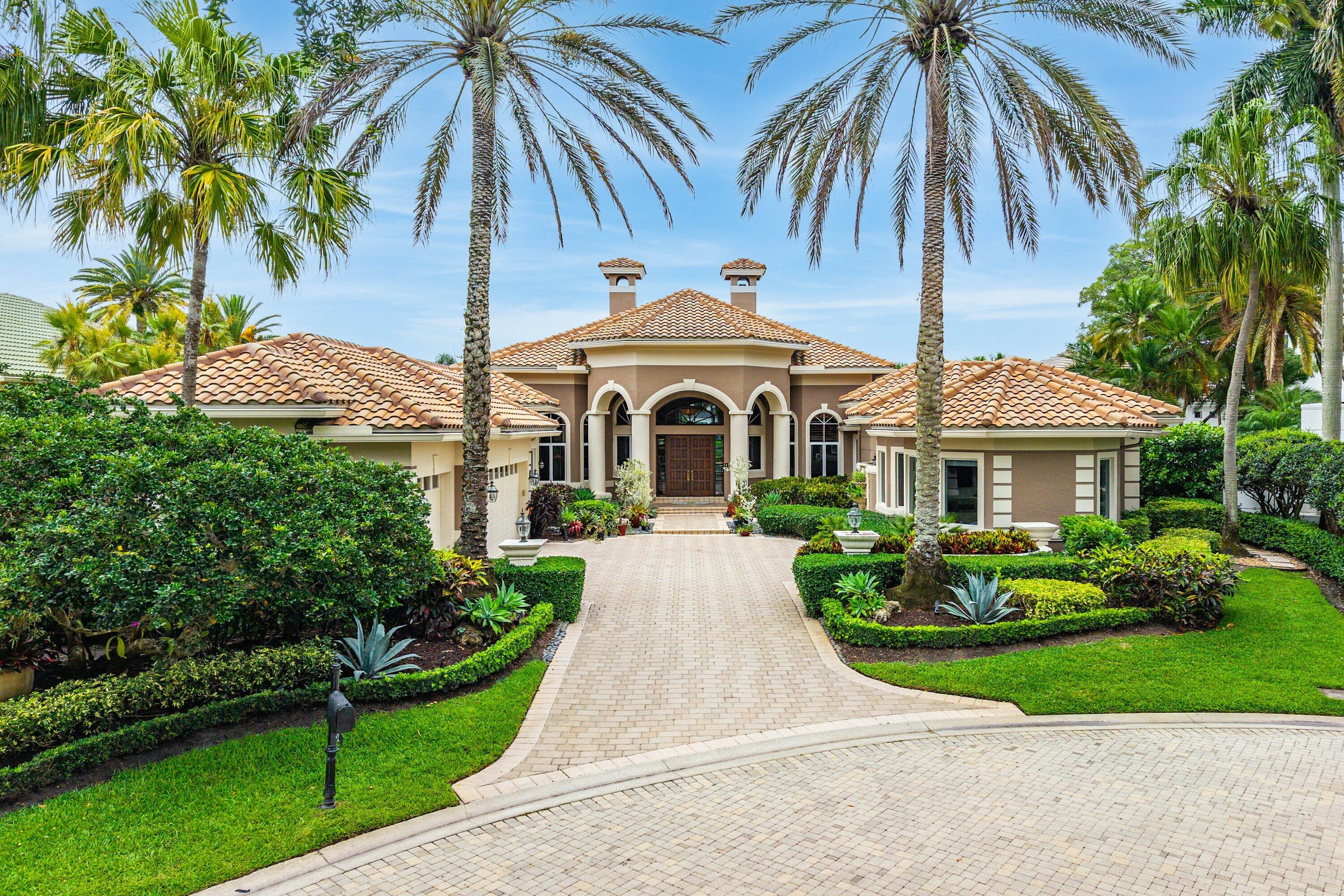 Experience the pinnacle of luxury living in this exquisite 4-bedroom, 5.5-bath custom estate home nestled within the prestigious community of BallenIsles Country Club. Designed for both grand entertaining and comfortable everyday living, this exceptional residence showcases expansive floor-to-ceiling windows that flood the interiors with natural light while seamlessly blending the lush tropical landscape with the elegant indoor living spaces. The thoughtfully designed floorplan features a beautifully appointed private home office, offering the perfect setting to work in comfort and style. The luxurious owner's suite is a true retreat, complete with dual his-and-her bathrooms and closets, a spacious sitting area, dressing room, and refined finishes throughout.   Guests will feel right at home in the recently renovated private casita featuring hurricane-impact glass windows and generous accommodations ideal for extended stays.  Outdoor living is equally impressive with a stunning resort-style pool, expansive patio areas, and a fully equipped summer kitchen designed for effortless entertaining year-round.  This remarkable property includes a full golf membership and access to the world-class amenities that BallenIsles Country Club is renowned for, including championship golf, an extraordinary clubhouse, tennis facilities, resort-style swimming pools, fine and casual dining, fitness amenities, and an unparalleled country club lifestyle.