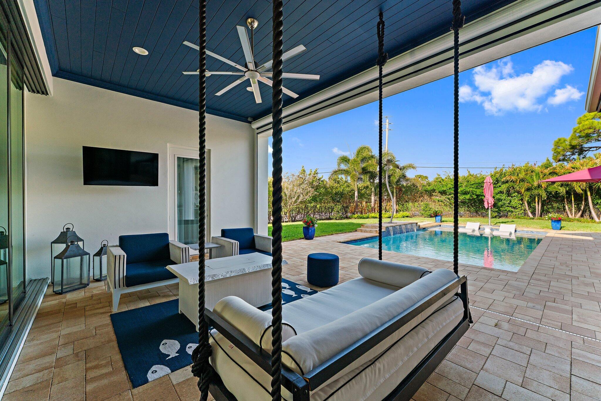 STUNNING! NEW 2021 CUSTOM BUILD in the Affluent IntraCoastal Neighborhood of Indian Hills, Jupiter. HIGH END DETAIL from the Mitored Roof Tiles eliminating ridge cap tiles to the Solid Wood Herringbone Hardwood Floors. The ATTENTION to DETAIL is BEYOND! Please refer to Details in Supplement. Whole House Generator. 220 Outlet for Electric Vehicle in 3 Car Garage.Remote Recessed Roll Down Screens at Covered Patio.Corner Close+Pocketing IMPACT SLIDERs.Custom Front Double Doors w/Solid Brass Hardware + Lock System.Large STONE Outdoor Wood Burning FIreplace.Resort stylPool w Waterfalls+Beach Ledge.Travertine Patio+Circular Dr.Open Split Floor Plan. Huge Walk In Pantry. Natural Quartz Countertops. Designer LIGHT+PLUMBING