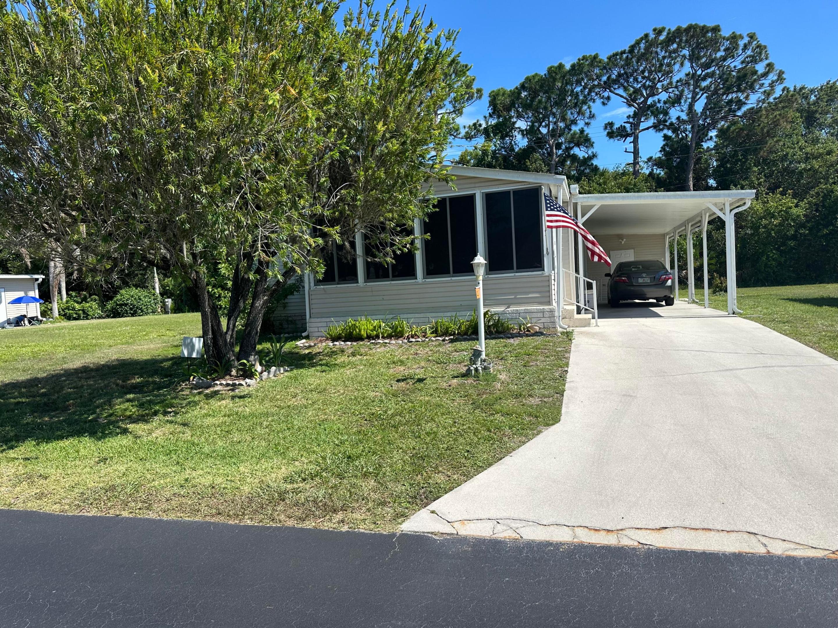 Large 3 bedroom 2 bath home backing to the trees and an empty maintained lot beside the home.  Needs updating but has great bones and a split bedroom floorplan, large living area and glassed in porch.  Inside laundry.  All information is approximate, buyer to verify all.