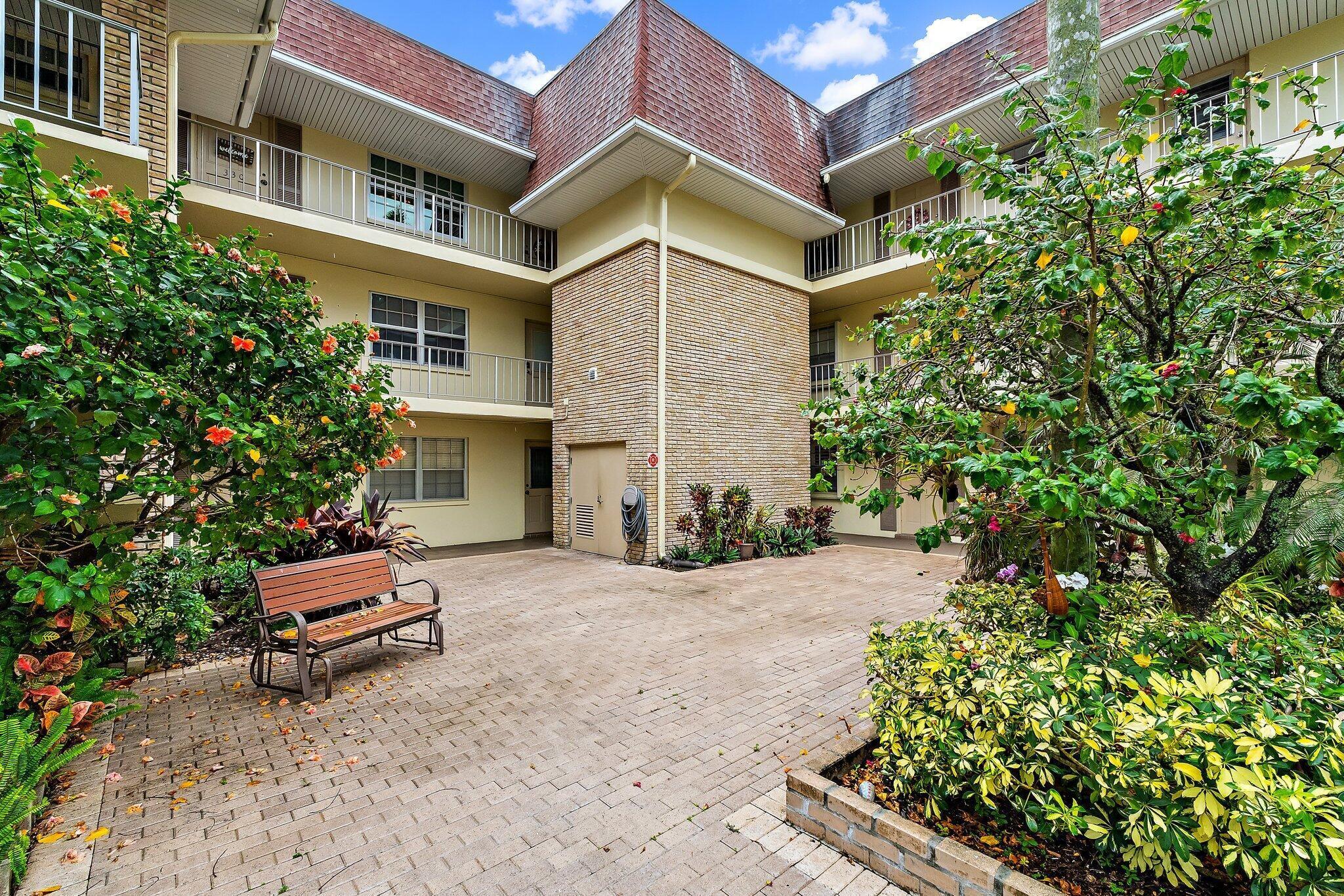 Don't miss this lowest-priced renovated first-floor condo in Tamberlane, complete with an enclosed patio and a dedicated covered parking space. The motivated owner has already paid the COA special assessment in full, offering added value and peace of mind. Step inside to an immaculate, move-in-ready interior featuring a spacious split floor plan. The living areas boast ceramic tile flooring, while the bedrooms feature warm laminate wood floors. Additional upgrades include crown molding, ceiling fans, and elegant plantation shutters throughout. The updated kitchen opens seamlessly to the living room and includes modern appliances and refreshed cabinetry—perfect for both everyday living and entertaining. The expansive living and dining area flows      the enclosed patio, creating a bright  and versatile space.  The primary suite offers a renovated en-suite bathroom and a generous walk-in closet. On the opposite side, the guest suite provides privacy, ample closet space, and its own en-suite full bathroom. Conveniently located just steps from the community laundry room, this condo also includes accordion hurricane protection, a covered entry, exterior storage, and access to a building elevator. Enjoy a short walk to the clubhouse, pool, and picnic/barbecue areas.