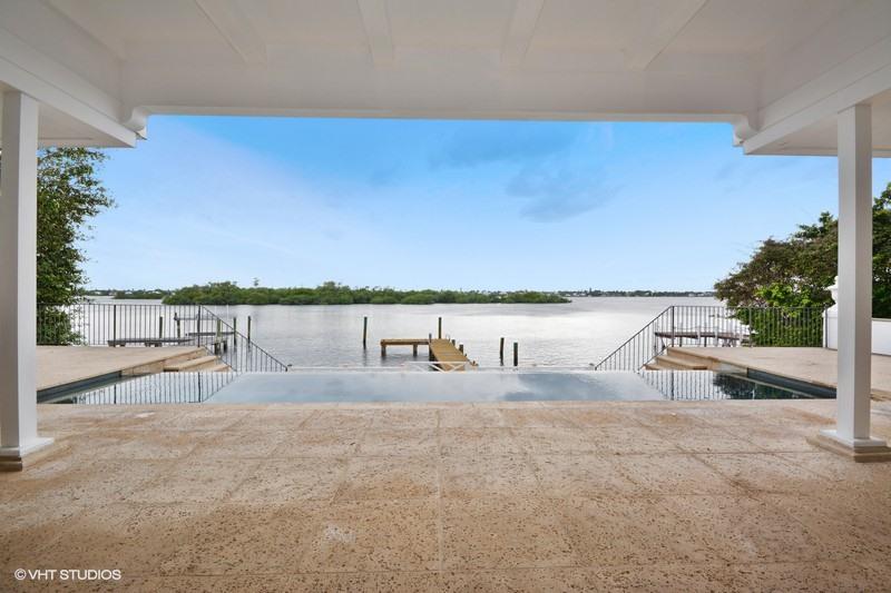 Stunning, Lake Front Clarence Mack regency with exceptional water views.  Nestled within a private cul-de-sac.  Classic, small scale regency with high ceilings and historic details.  Renovated interiors featuring a gym/media room; multiple bedrooms; guest kitchen/laundry and so much more.  Dock; infinity pool; beach access.  The BEST OPPORTUNITY in Palm Beach.