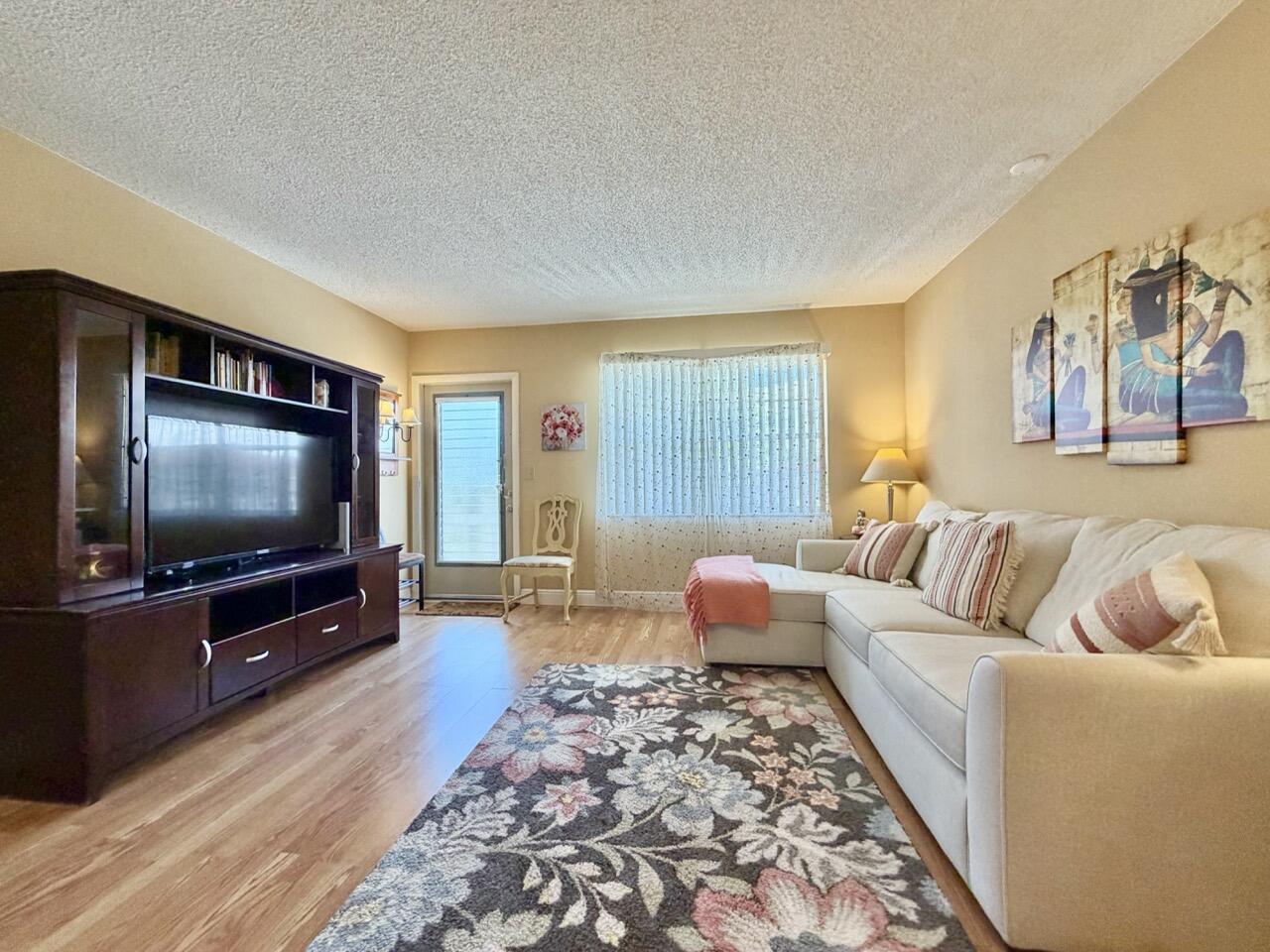 Welcome to tranquil 55+ living in the heart of West Delray Beach! This charming 1-bedroom, 1-bath residence is located on the 2nd floor of a peaceful 2-story building and features an enclosed balcony with sliding glass doors from both the kitchen and bedroom, creating the perfect space to relax and enjoy the serene surroundings. The beautifully maintained community offers resort-style amenities including 2 pools, clubhouse ballroom, gym, sauna, library, billiards and card rooms, clubhouse kitchen, and gathering spaces for social events and private parties. Enjoy scenic walking paths, lush landscaping, mature trees, and peaceful lake views throughout the community.  Besides on-site management, grounds maintenance, common areas, pool service, building exterior insurance and so much more; cable tv, internet, water, trash and sewer is also included in the quarterly association payment and owner only pays for electricity!  The roof on building 19 was redone within the last 3 years! Abbey Village is located approximately 8 miles to Delray Beach!