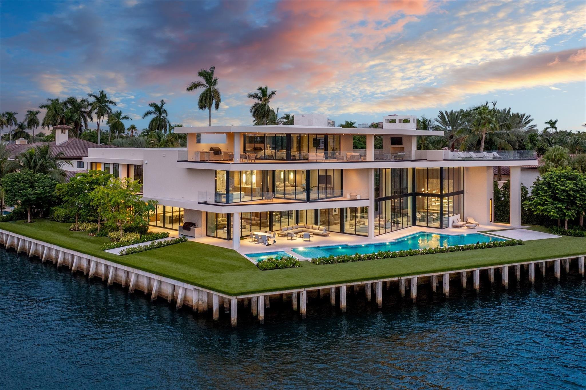 A masterpiece of modern waterfront luxury, 625 San Marco is a brand-new point lot estate designed to astonish, by Carlos Martin Architects & Bomar Builders. Spanning 3 floors & over 10,000SF with 277' of prime water frontage, this fully furnished residence w interiors by Artistic View blends modern sophistication w natural warmth. Open living spaces showcase oak millwork, Italian porcelain & walls of glass framing panoramic Intracoastal views. Features include an expansive primary suite, chef’s kitchen, office, 2 fireplaces, 2 summer kitchens & a third-floor roof deck/lounge complete w a temperature controlled wine room. Outside, enjoy a 70' lap pool, spa & mega yacht dockage. A commercial-grade elevator, Lutron lighting & Savant smart home integration complete this statement of elegance.