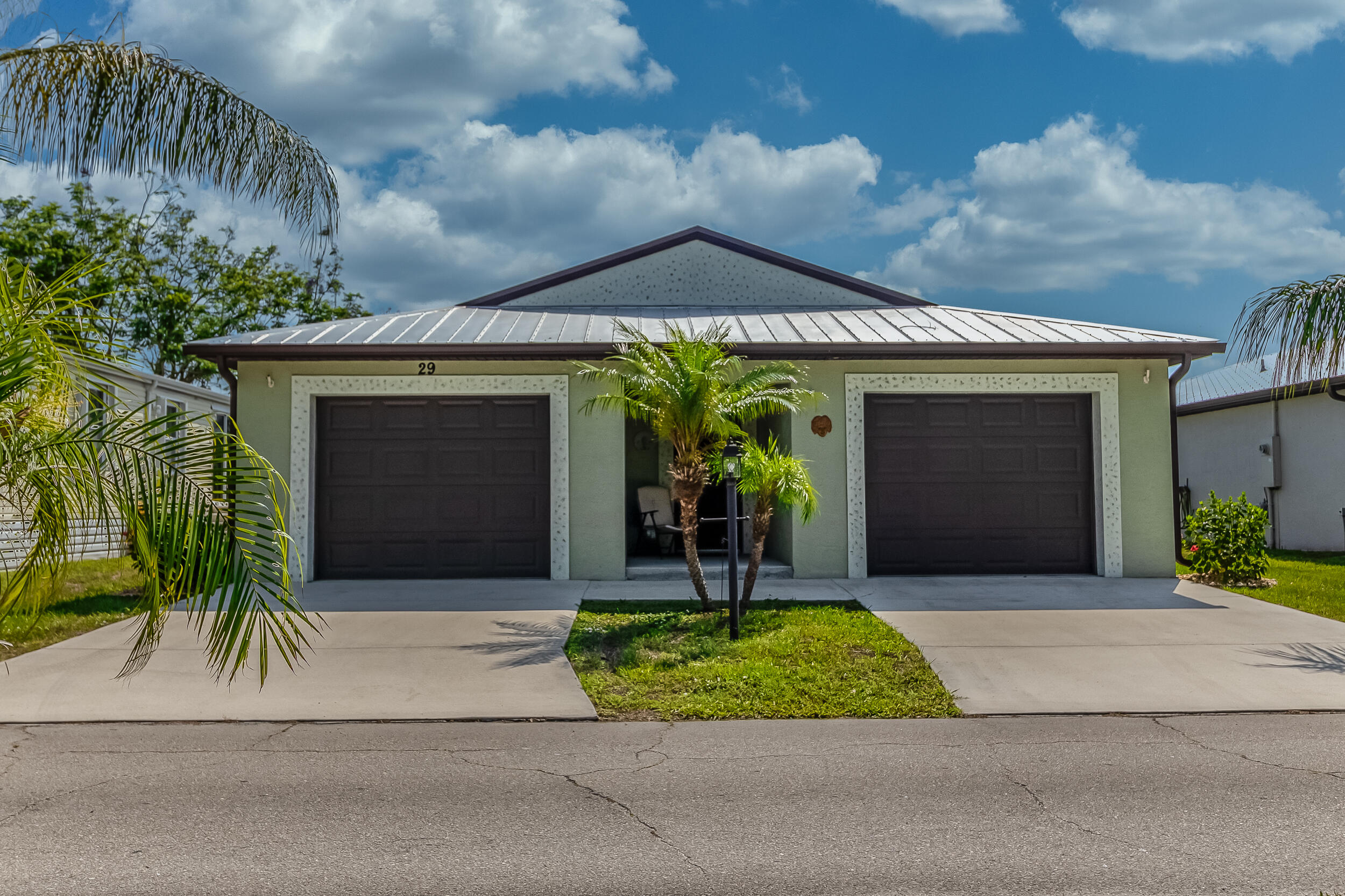 Experience easy Florida living in this beautifully maintained 2-bedroom, 2-bath home nestled in the desirable 55+ community of Spanish Lakes One. This inviting residence offers a bright, open layout with abundant natural light, a spacious kitchen featuring generous cabinetry and workspace, and a comfortable primary suite complete with a walk-in closet and private bath. The monthly land lease includes lawn maintenance, trash service, and access to an exceptional array of resort-style amenities, including two heated pools, an active clubhouse, fitness center, sauna, library, woodworking shop, arts & crafts, billiards, and more. Enjoy endless recreational opportunities with a 9-hole golf course, tennis, pickleball, bocce, shuffleboard, softball, and horseshoes. Come and see it today!