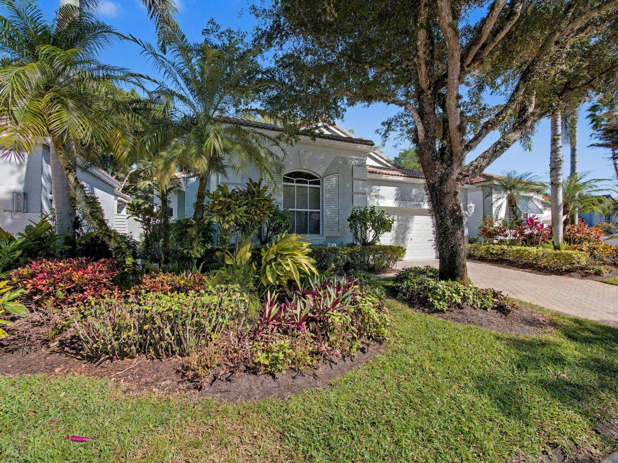 Exceptional opportunity in the sought-after Sunset Bay neighborhood of BallenIsles. This well-cared-for 3-bedroom, 2.5-bath single-story home offers 1,878 square feet of living space, a desirable garden view, enclosed patio, and two-car garage.  Ideally located near the entrance of Sunset Bay, the home combines convenience with privacy and has been meticulously maintained by its owners. The spacious floor plan provides comfortable everyday living and serves as the perfect canvas for a buyer looking to create their own vision within one of Palm Beach Gardens' most prestigious country club communities.  Social Membership included. Enjoy access to the renowned BallenIsles lifestyle with exceptional dining, social events, and resort-style amenities.