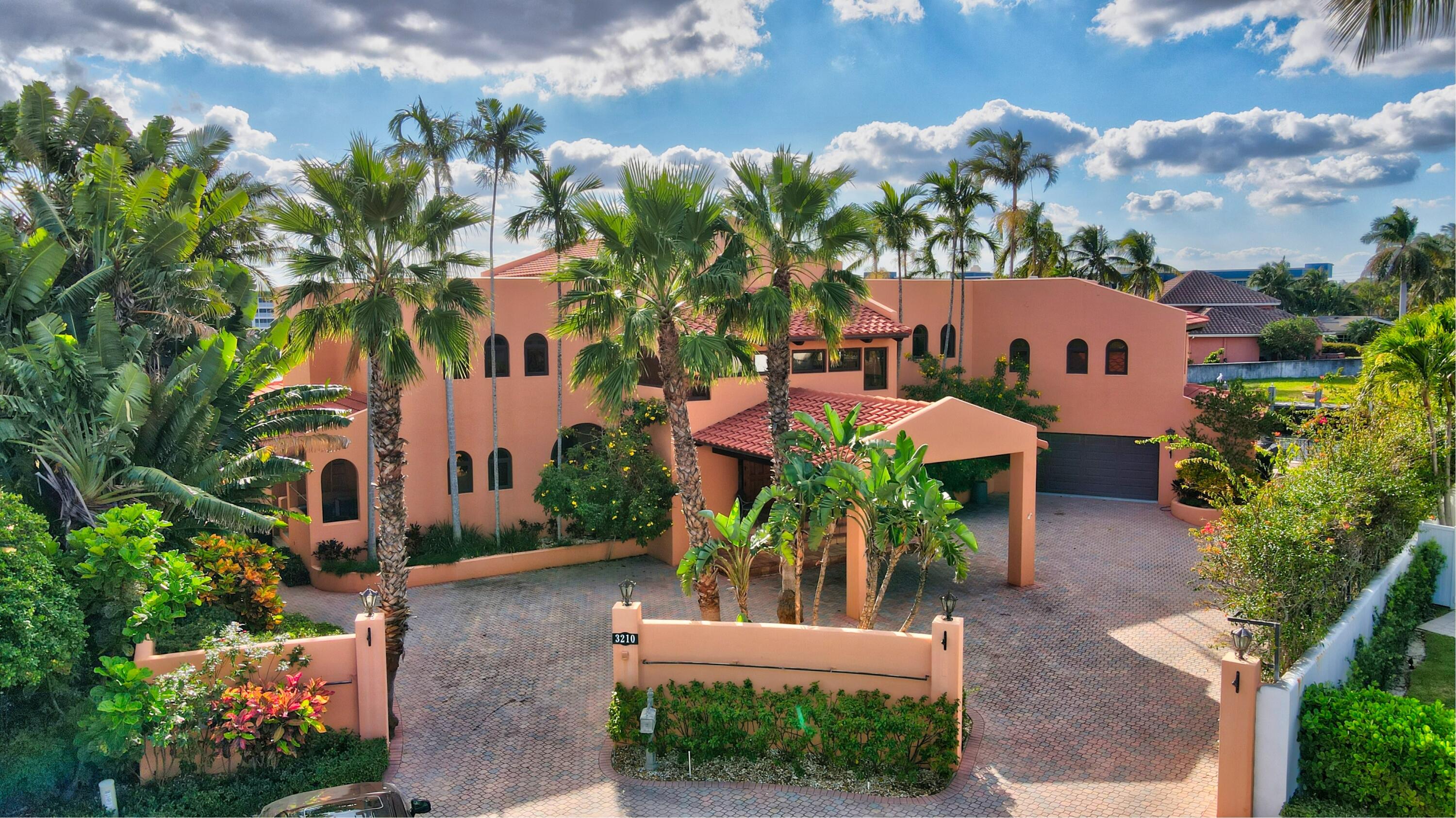 Fabulous 2 story Spanish style home built on a magnificent 17,000 plus square foot interior point lot on Tropic Bay Harbor. Appx 220 feet of totally protected dockage with no rough wake from the Intracoastal. Possible to dock several large boats here over 60+ feet each. House is all CBS construction but needs updating on the inside. Unbelievable views from your dock and deck area in the rear of this home. Aerial photos coming soon. No interior photos will be taken as the house is a total redo on the inside. Showings to begin on December 8th by appt only.  All offers to be reviewed on Monday the 13th. Sold As IS, cash offers preferred. Only use Far Bar As Is contracts. Mortgage contingencies must be waived in any contract. This home is priced at land value so be prepared for multiple offers