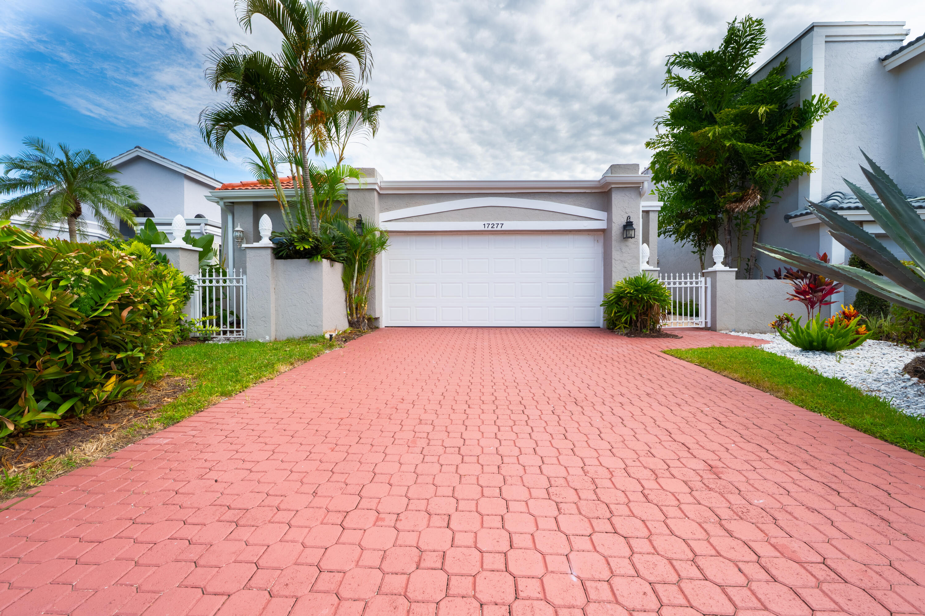 Welcome to this 3/2 house in the central-Boca neighborhood of Newport Bay Club. Completely reimagined with largeopen floorplan. Brand New Impact Windows/Doors. Roof 2023, AC 2025. New Gutters. Brand new large 48x48 luxury rectified tiles in living area and vinyl floors in guest bedrooms. All new paintthroughout. Brand new kitchen featuring high end double-stacked cabinets and white quartz countertop and a large island. Brand new stainless appliances.All new bathrooms including large frameless showers, new vanities with quartz countertops. LED recessed lighting in main living area. Private backyard with apool perfect for entertainment. Minutes away from great schools, restaurants, parks etc. Community has a clubhouse, fitness center, pool, basketball andtennis courts, landscaping included.