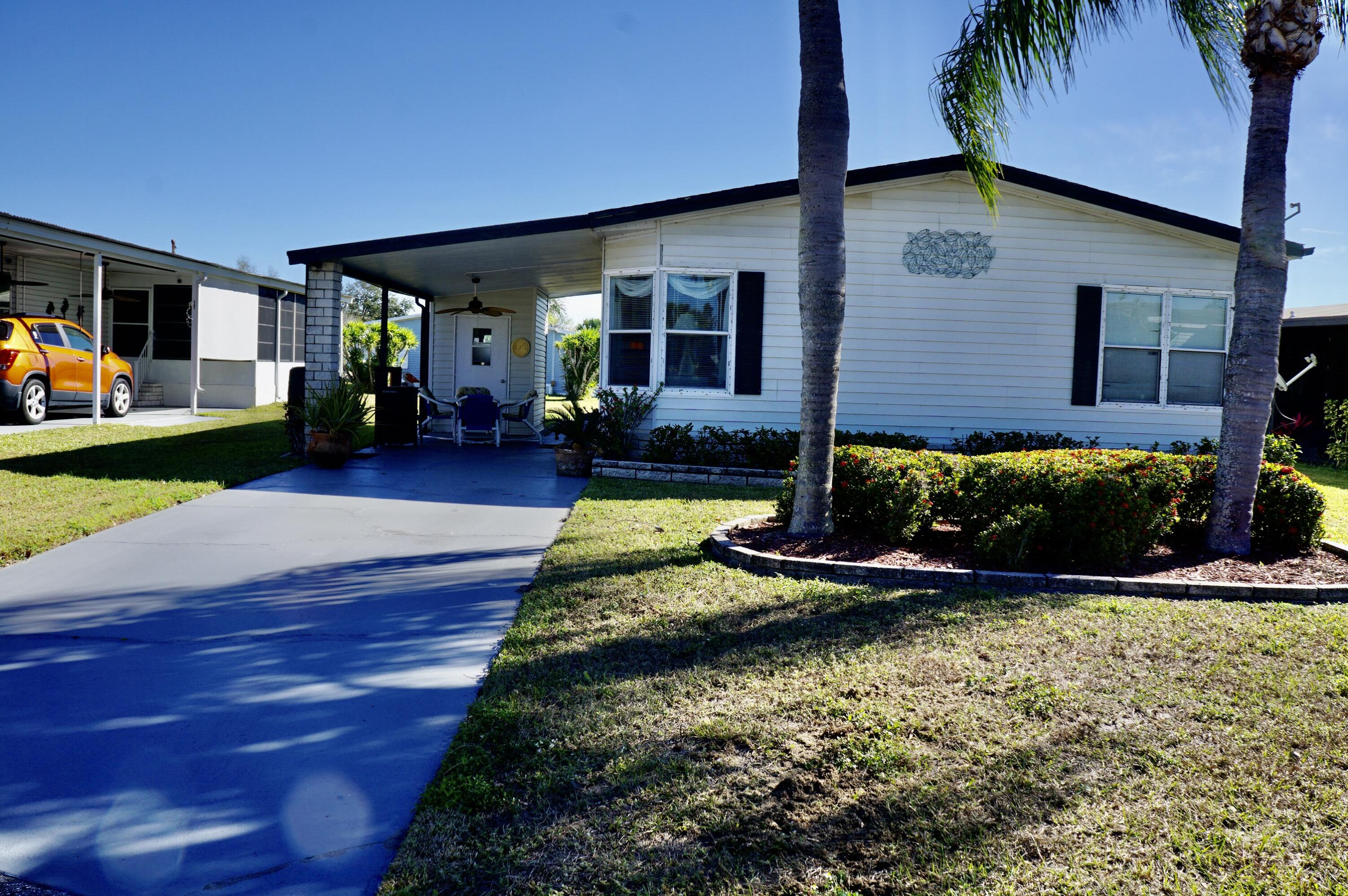 FREE GOLF! Located on a cul-de-sac this beautifully maintained 2-bed/2-bath home is offered fully furnished and ready for immediate occupancy. Features include large kitchen, inside washer & dryer, 2023 a/c, and an extra chest freezer. Large screened Florida Room! Shed for tools & pool floats! For peace of mind, home comes with Kevlar hurricane screens to protect windows from storms. Perfect home for full-time residence, or a seasonal escape from the cold! Offered at a great price, ready to sell! This land leased home is located in the desirable Spanish Lakes Fairways Community. You must be approved by the park to purchase a home. This is a 55+ park that offers a relaxed lifestyle for those who are ready for a break. And for the active seniors, Spanish Lakes offers all inclusive... resort like, amenities with a community clubhouse, FREE golf, social events, tennis, billiards, shuffleboard, swimming, fitness center, and more. There is NO HOA fee. Your $931 land lease pays for everything including your lawn maintenance, trash removal, property taxes and community activities. You'll find this home is tucked away into a private community, yet within a few miles of the beach, hospitals, and shopping.