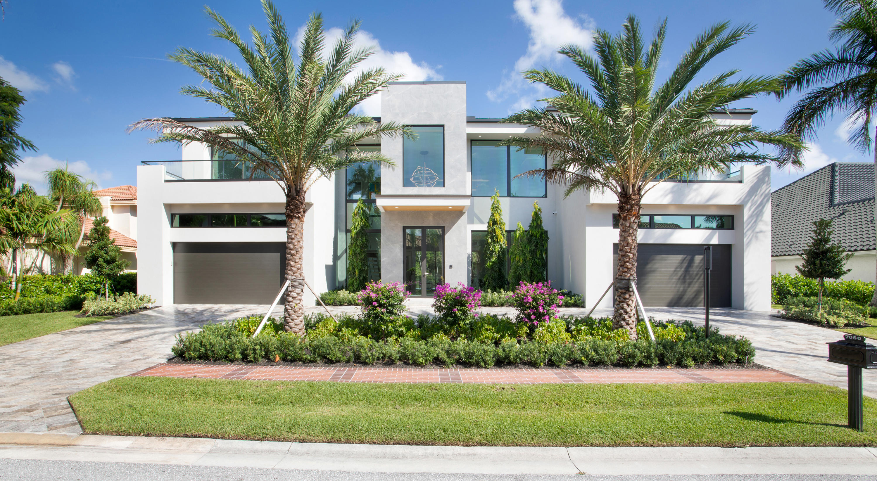New construction. This impeccably designed modern masterpiece is stunning in both scale and sophistication, featuring 6 bedrooms, 7 full bathrooms and 3 half bathrooms spanning over 8,100 sq ft. Offering gallery like spaces that are both expansive & intimate. An architecturally significant floating staircase & elevator connect the two levels. The upper level houses 4 en-suite bedrooms with stunning golf course and park vistas, utility, club room, multiple entertaining spaces, and tremendous balconies. The home's main level features show room garages, a breath taking glass office, designer kitchen, multiple living areas, master bedroom with 2 closets and 2 designer bathrooms, a 24 ft grand foyer, staff quarters and a water vapor fireplace. Other features include poured concrete second floor, hurricane impact windows and doors, full house generator, elevator, and four car garage. Enjoy a resort style pool and Italian marbled entertainment lanai with an expansive summer kitchen. The spectacular interiors were masterfully designed and boast an array of coveted finishes of the highest quality. This estate stands out as a rare architectural gem that offers unparalleled attention to detail.