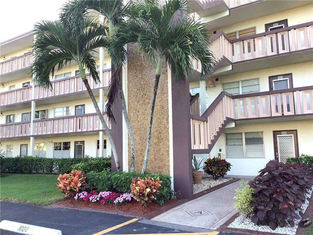 Senior Community! Turn Key LAKE VIEW!! Priced to sell! Gorgeous panoramic Lakeview, second floor unit with screened patio, updated bathrooms and open kitchen, tile & carpet floors, granite countertops, high cabinets and beautiful backsplash, bathtub shower combination in guest bathroom, recess light, bright and clean, walk-in closet, large patio closet located in the nicest section of Century Village and not far from the main clubhouse. $540.00 Combined condo fees include security, roof, building insurance, tennis, fitness, courtesy bus, common areas maintenance, water, cable, 92,000 Sq Ft state-of-the-art luxury clubhouse, indoor pool, theater, library, billiard, health club, 24/7 manned gate, multiple satellite pools through the community and more.