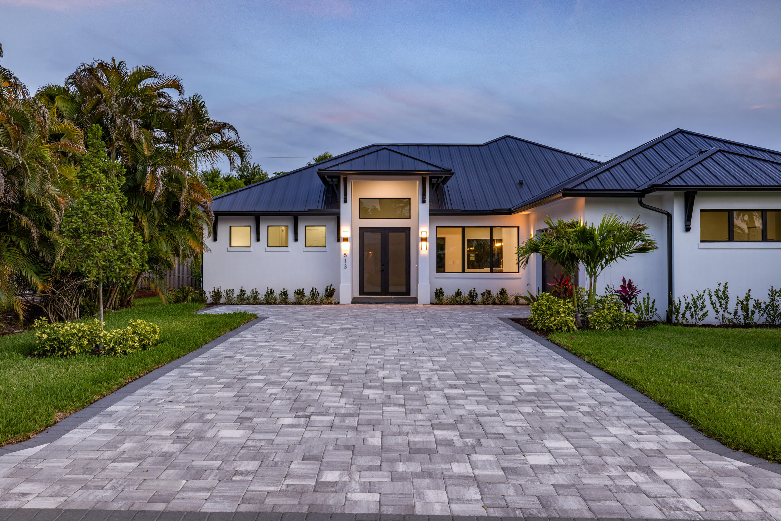 Positioned in one of Stuart's most convenient and increasingly desirable locations, this newly completed 2025 residence presents a clean, modern take on Florida living with the comfort and ease of true new construction. Offering 2,486 square feet under air, the home blends generous interior volume, elevated ceilings, and a thoughtful floor plan with the advantage of being moments from many of the lifestyle destinations that continue to define Stuart.  Located just minutes from Historic Downtown Stuart, the Lyric Theatre, waterfront dining, local boutiques, beaches, marinas, weekend farmers markets, and everyday conveniences, the setting captures the balance between accessibility and the laid-back coastal character that has made Stuart one of South Florida's most sought-after towns.   Inside, the residence showcases a contemporary coastal architectural design with a well-designed 4-bedroom, 3-full-bath split floor plan built for both everyday comfort and entertaining. Vaulted ceilings create an open, airy atmosphere throughout the main living areas, while clean modern finishes, impact windows and doors, and a seamless roofline reflect the quality, and simplicity buyers are searching for in newer construction. The backyard offers ample space for a future custom pool, outdoor entertaining area, workshop, or potential ADU, allowing flexibility for future expansion and personalization.  New construction of this scale and quality, positioned in such a central Stuart location, remains increasingly difficult to find. This is an opportunity to step into a brand-new home while remaining close to everything that makes life on the Treasure Coast so desirable.  All interior and exterior photos have been virtually staged. The pool and ADU / secondary structure renderings are for visual purposes only and are examples of what may be built.