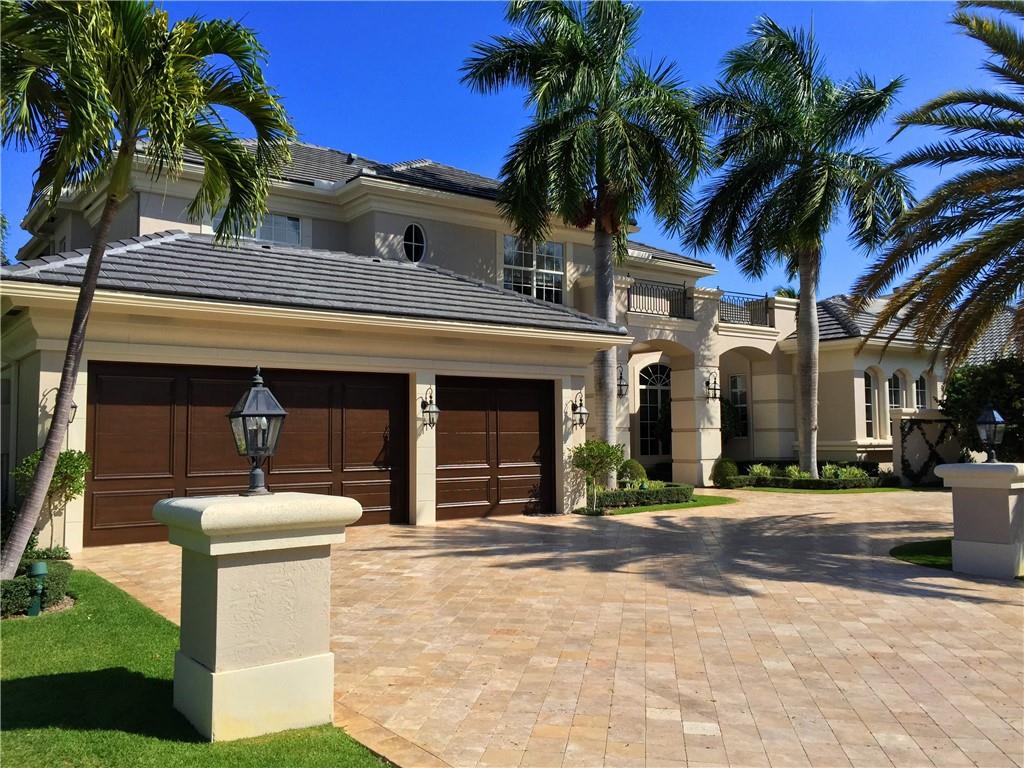 Magnificent & totally renovated five bedrooms waterfront estate home in Royal Palm Yacht & Country Club with five full, two half bath, stunning two story entrance & formal living room with impressive view, large family room, formal dining, spacious gourmet kitchen, office/library, oversized ground floor master suite with his & her bath, three & half air conditioned car garage spans over 7000 square feet total. Ultra luxury signature property totally renovated. Located on over 15000 Square feet lot with 104 feet on the waterway together with private deep-water dock fully equipped, fabulously furnished and featured to fulfills every desire & need. CBS construction, impact glass & generator. 191 W Coconut Palm Road epitomizes the height of Florida luxurious living.