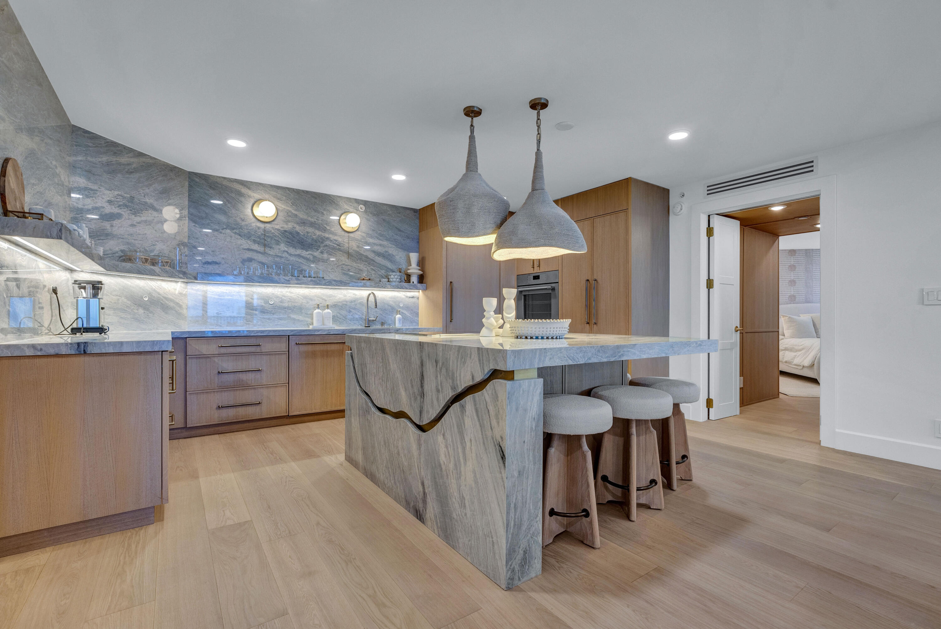Palm Beach luxury has seen many renovations, but few as rare as this. Tucked inside The Enclave, this one-of-one 3-bedroom, 3-bathroom oceanfront residence was fully re-engineered and redesigned by HW Interiors into a true coastal design statement. Warm organic textures, custom finishes, and ocean-inspired materials create a home that feels elevated, serene, and luxurious. Hidden bedrooms add an unexpected design element, enhancing the home's custom feel and thoughtful layout. From quiet morning sunrises on the water to sunset entertaining, this residence captures the best of the Palm Beach lifestyle. Set to be featured by Modern Luxury in Fall 2026, this is more than a condo. It is a collectible oceanfront escape.