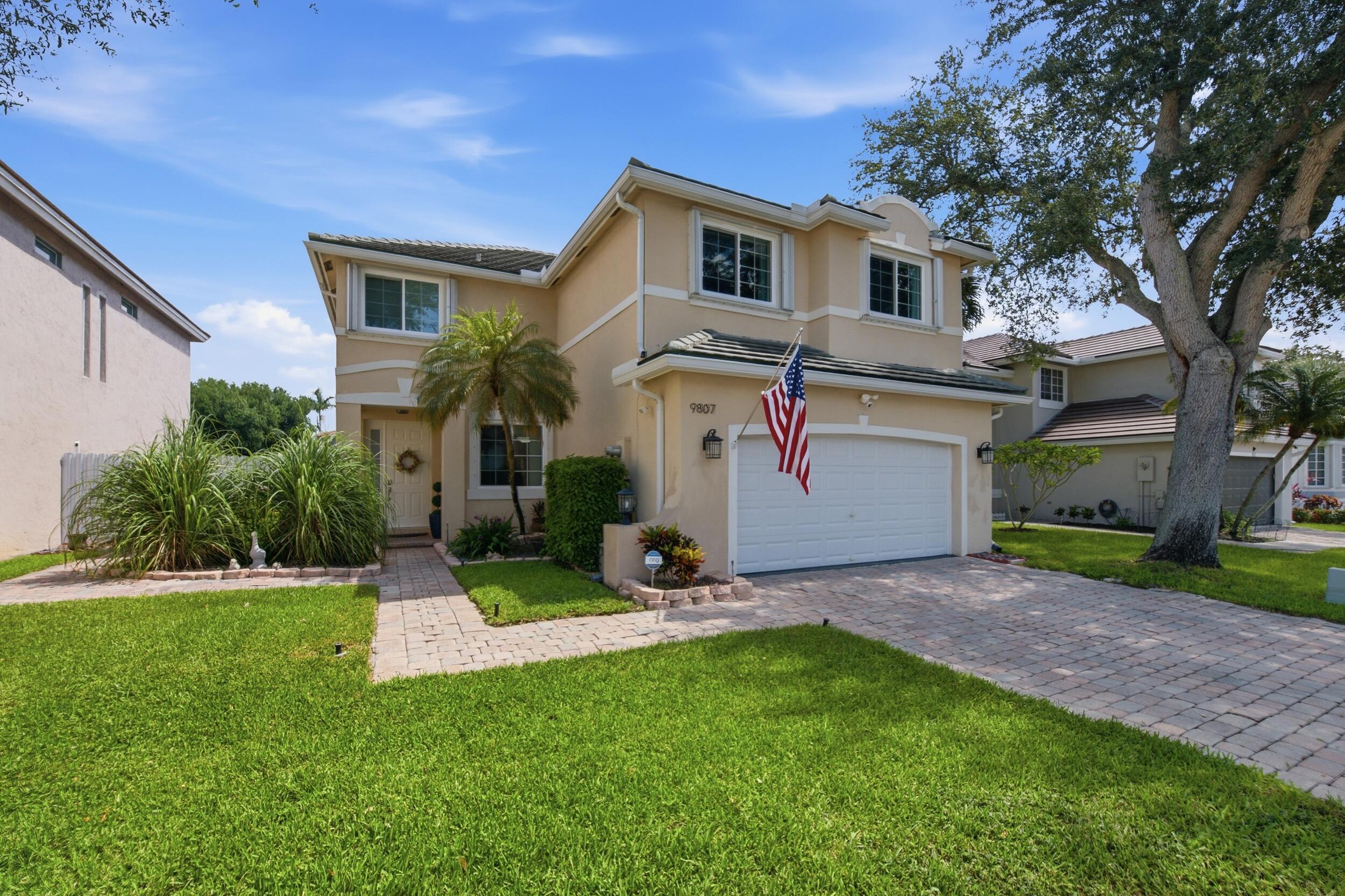 Welcome home to this meticulously maintained 5-bedroom, 3.5-bathroom, 2-car garage waterfront residence, proudly offered by its original owner and located within the desirable gated community of Normandy at Pembroke Lakes. Situated in a highly sought-after school district and featuring low HOA fees, this exceptional home offers the perfect combination of space, comfort, and peace of mind.  Notable updates include full impact glass throughout (2023), a newer tile roof (2018), a brand-new privacy fence enclosing the backyard (2025), all newer high-end kitchen appliances, updated bathrooms, engineered bamboo wood flooring throughout the second level (2018), and updated fixtures throughout. As you step inside, you'll immediately appreciate the attention to detail, including diagonally laid tile flooring throughout the main living areas, soaring 9 foot ceilings, and an abundance of natural light. Just off the entryway are the formal living and dining rooms, both enhanced with updated fixtures and oversized sliding glass doors in the formal living space that frame beautiful waterfront views while providing direct access to the covered patio.  The beautifully updated kitchen is designed for both everyday living and entertaining, featuring sparkling black granite countertops with a matching full-height backsplash, bar-top seating accented by pendant lighting, newer stainless steel appliances, solid wood shaker-style cabinetry, recessed lighting, and a dedicated pantry. Impact sliding glass doors lead directly to the screened and covered patio, creating seamless indoor-outdoor living. Adjacent to the kitchen is a spacious breakfast nook and inviting family room filled with natural light from large windows overlooking the water. A conveniently located half bath and a full laundry room complete with newer LG front-loading washer and dryer add to the home's functionality.  The spacious primary suite offers engineered bamboo wood flooring, an elegant tray ceiling, updated lighting, a large impact window overlooking the water, and a generous walk-in closet. The luxurious primary bathroom features his and hers sinks on a vanity with solid wood cabinetry and updated hardware, an oversized Roman soaking tub, and a fully tiled walk-in shower with updated fixtures.  All four secondary bedrooms are generously sized and feature engineered bamboo wood flooring, ample closet space, and large windows providing abundant natural light. One of the secondary bathrooms has been beautifully updated with a dual-sink vanity, modern tile flooring, recessed lighting, updated fixtures, and a fully tiled tub/shower combination accented by a decorative tile inlay. The other secondary bathroom is equally impressive, featuring an updated walk in shower with a framed glass enclosure and niche shelving.  Step outside to your private screened and covered waterfront patio, the perfect place to relax or entertain while enjoying peaceful water views. Complete with three modern ceiling fans and a fully fenced backyard, this outdoor space offers both comfort and privacy. The low HOA fee covers cable and internet, gate security, a community pool, and common area maintenance, helping maintain the community's beautifully kept appearance.  Ideally located within the gated community of Normandy at Pembroke Lakes, this home offers exceptional access to everything Pembroke Pines has to offer. Residents enjoy convenient proximity to Interstate 75, Florida's Turnpike, Pines Boulevard, and University Drive, making travel throughout Broward and Miami-Dade Counties effortless. The area is surrounded by highly regarded schools, premier shopping and dining, and outstanding recreational opportunities, including Pembroke Lakes Mall, The Shops at Pembroke Gardens, C.B. Smith Park, and Brian Piccolo Sports Park & Velodrome. Combining convenience, recreation, and an established residential setting, Normandy at Pembroke Lakes remains one of Pembroke Pines' most desirable communities to call home.