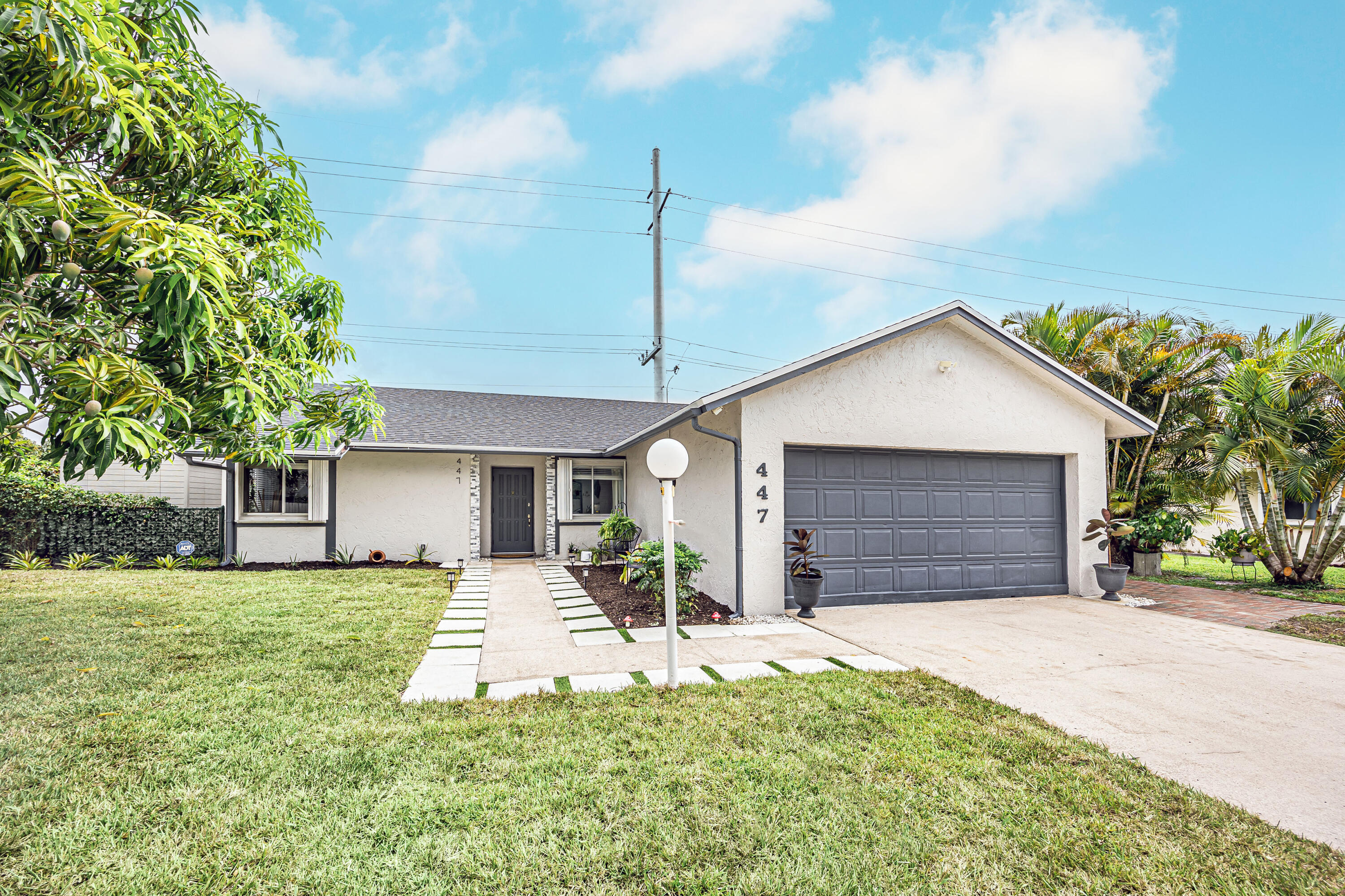 Beautifully updated home located in the heart of West Palm Beach with NO HOA! This move-in-ready property offers 3 bedrooms and 2 full bathrooms, plus a versatile bonus room that provides additional flexible space for a home office, gym, playroom, hobby room.  Recent improvements include a NEW roof (2026), A/C (2022), water heater (2023), renovated primary bathroom & additional bathroom updates updated electrical outlets, closets, and fresh landscaping. The home also features updated baseboards, modern appliances, and popcorn ceiling removal.  Enjoy a fully Natural fenced backyard with canal views, creating a private outdoor retreat perfect for entertaining and family gatherings. Conveniently located just minutes from Palm Beach International .